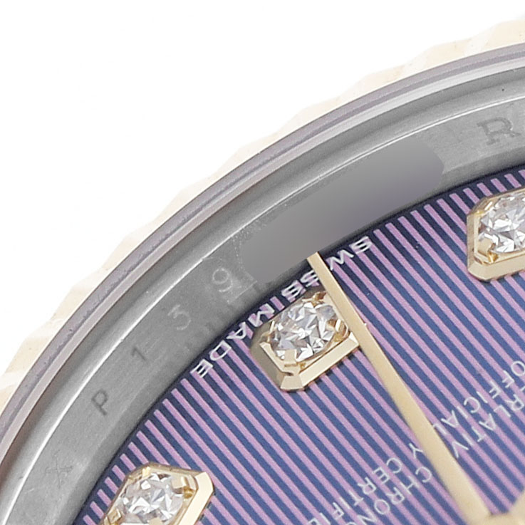 The image shows a close-up of the Rolex Datejust 279173 Women's Steel and Gold (two tone) Purple Dial's dial, featuring diamond indices and part of the bezel.