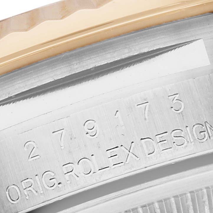 The image shows a close-up of the Rolex Datejust 279173 Women's Steel and Gold (two tone) Silver Dial 279173 Women's Steel and Gold (two tone) Silver Dial's engraved case back edge.