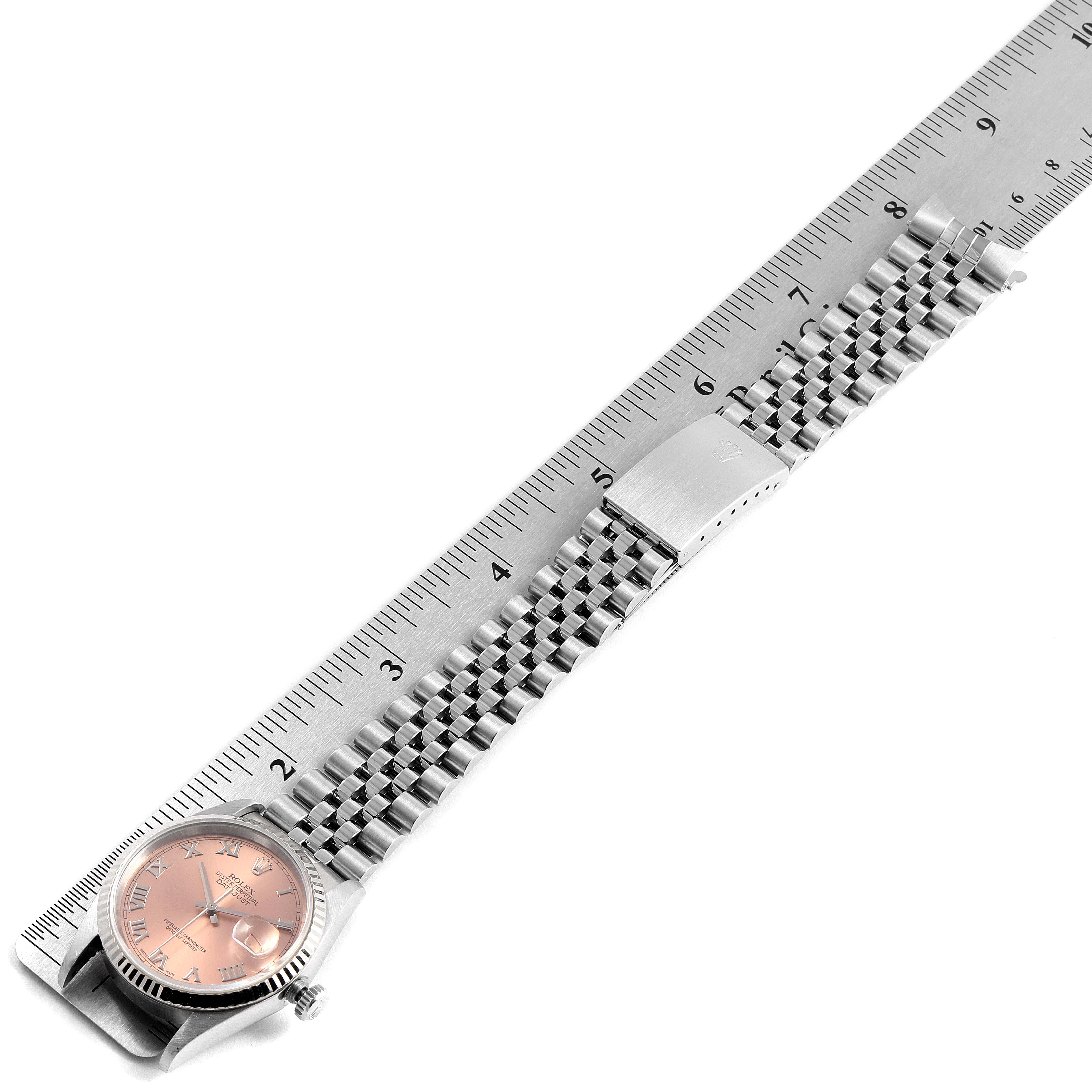 The image shows a Rolex Datejust 16234 Men's Stainless Steel Pink Dial 16234 Men's Stainless Steel Pink Dial watch laid flat with a ruler underneath for measurement.