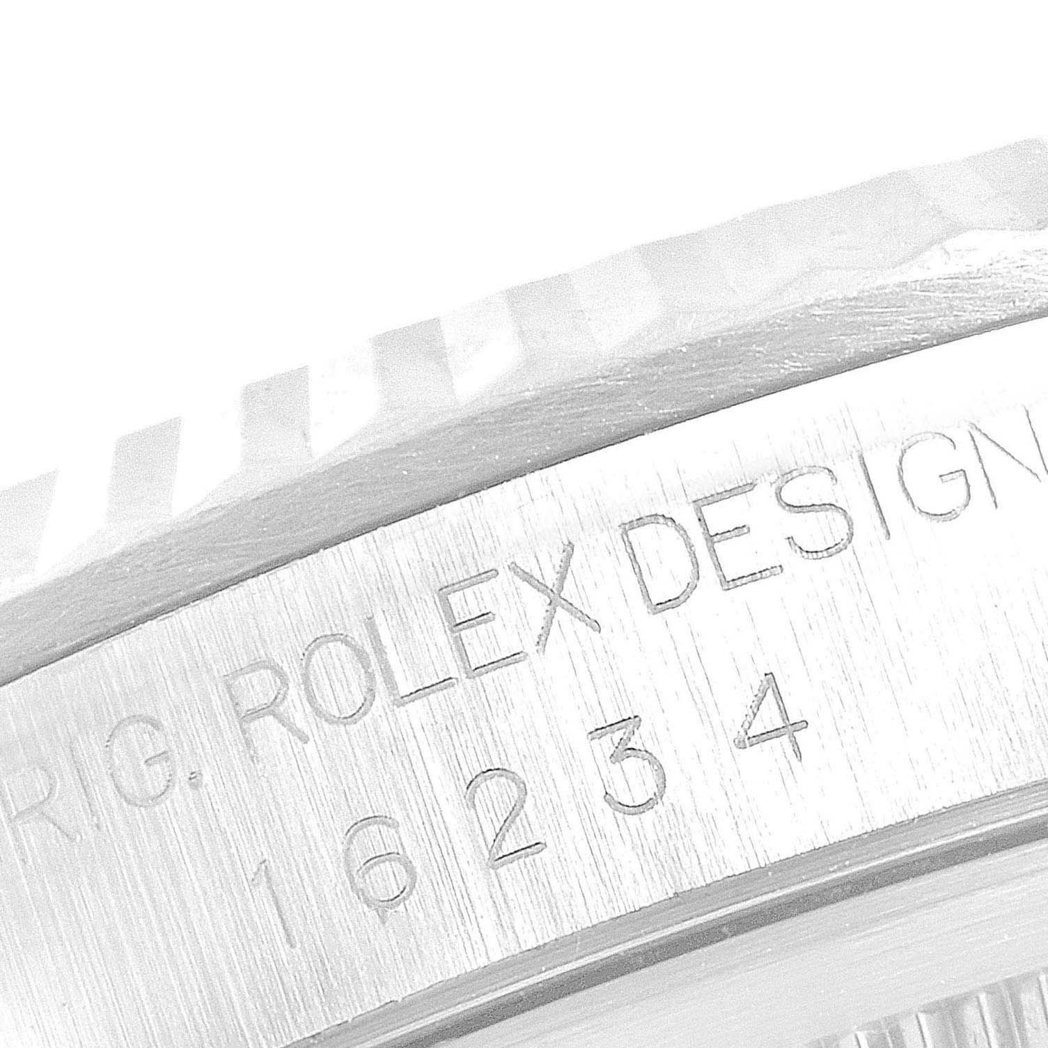 This close-up image shows the engraved model number and bezel edge of the Rolex Datejust 16234 Men's Stainless Steel Pink Dial 16234 Men's Stainless Steel Pink Dial.