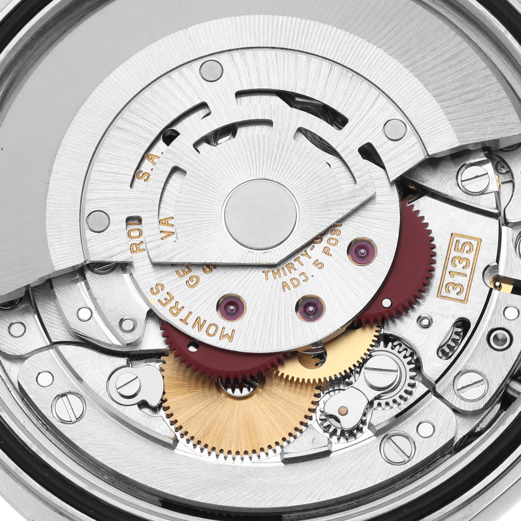 The image shows the movement and intricate gears of a Rolex Datejust 16234 Men's Stainless Steel Silver Dial 16234 Men's Stainless Steel Silver Dial watch, highlighting its internal mechanism.
