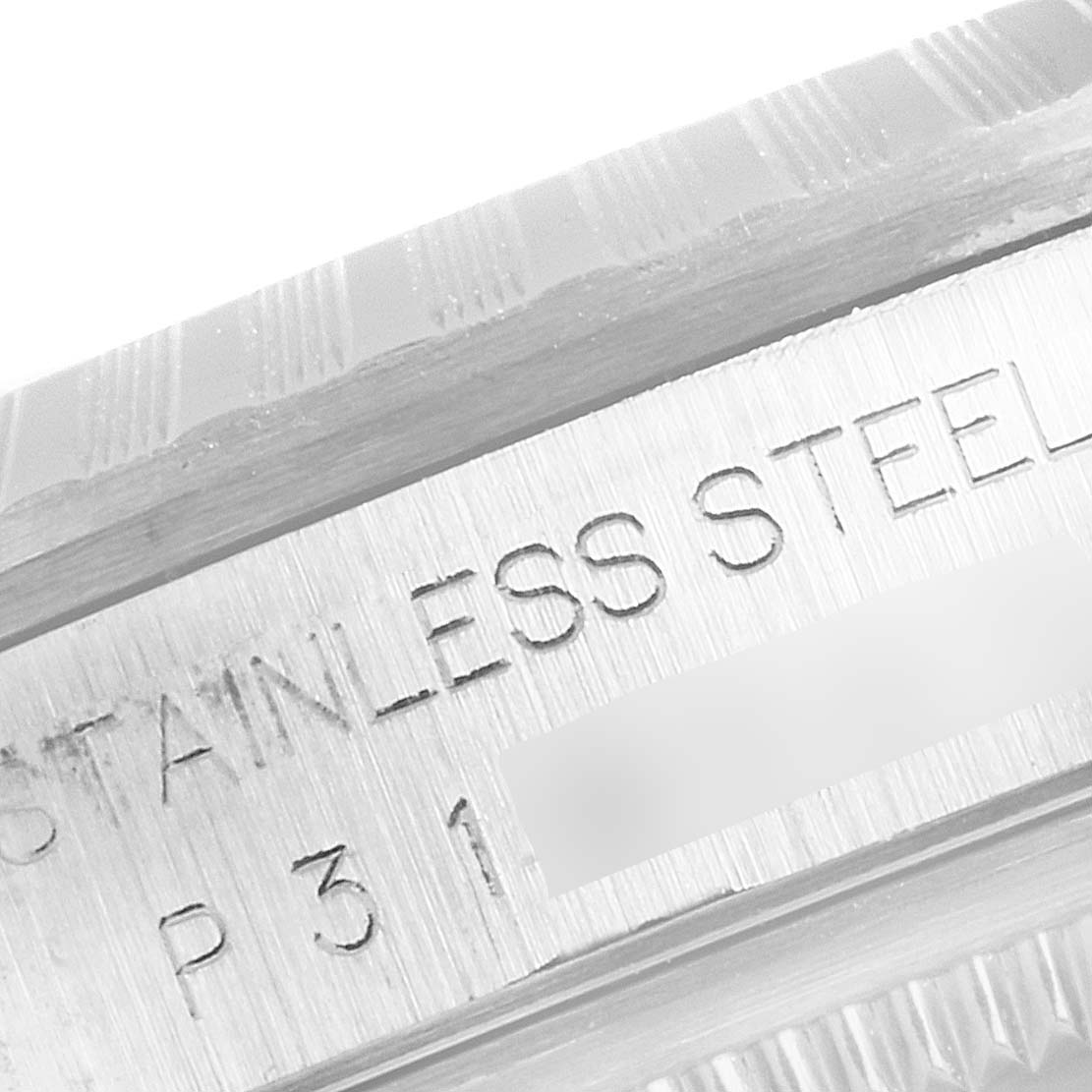 The image shows a close-up of the side engraving on the stainless steel casing of a Rolex Datejust 16220 Men's Stainless Steel Black Dial 16220 Men's Stainless Steel Black Dial watch.