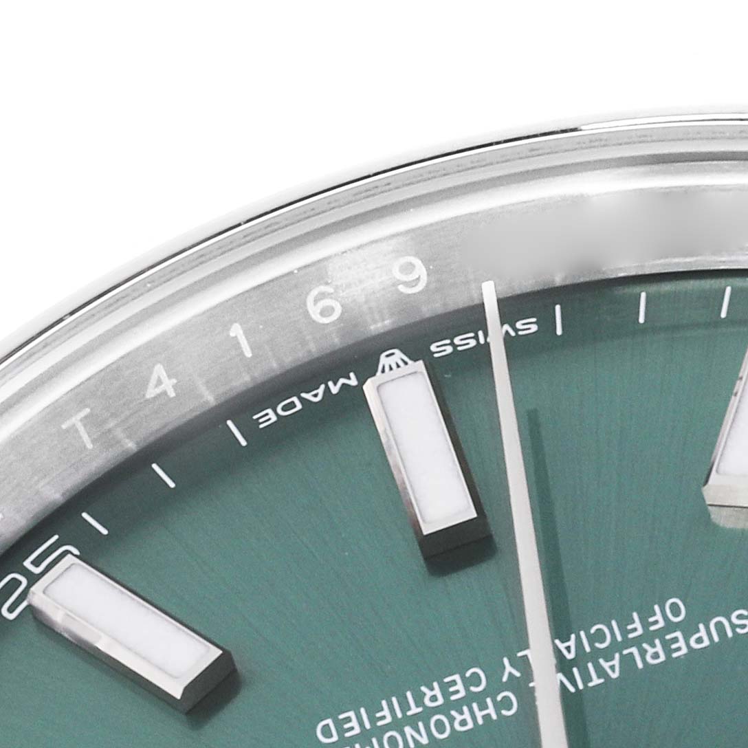 The image shows a close-up of the dial and hour markers of a Rolex Datejust 41 126300 Men's Stainless Steel Green Dial 126300 Men's Stainless Steel Green Dial watch at an angle.