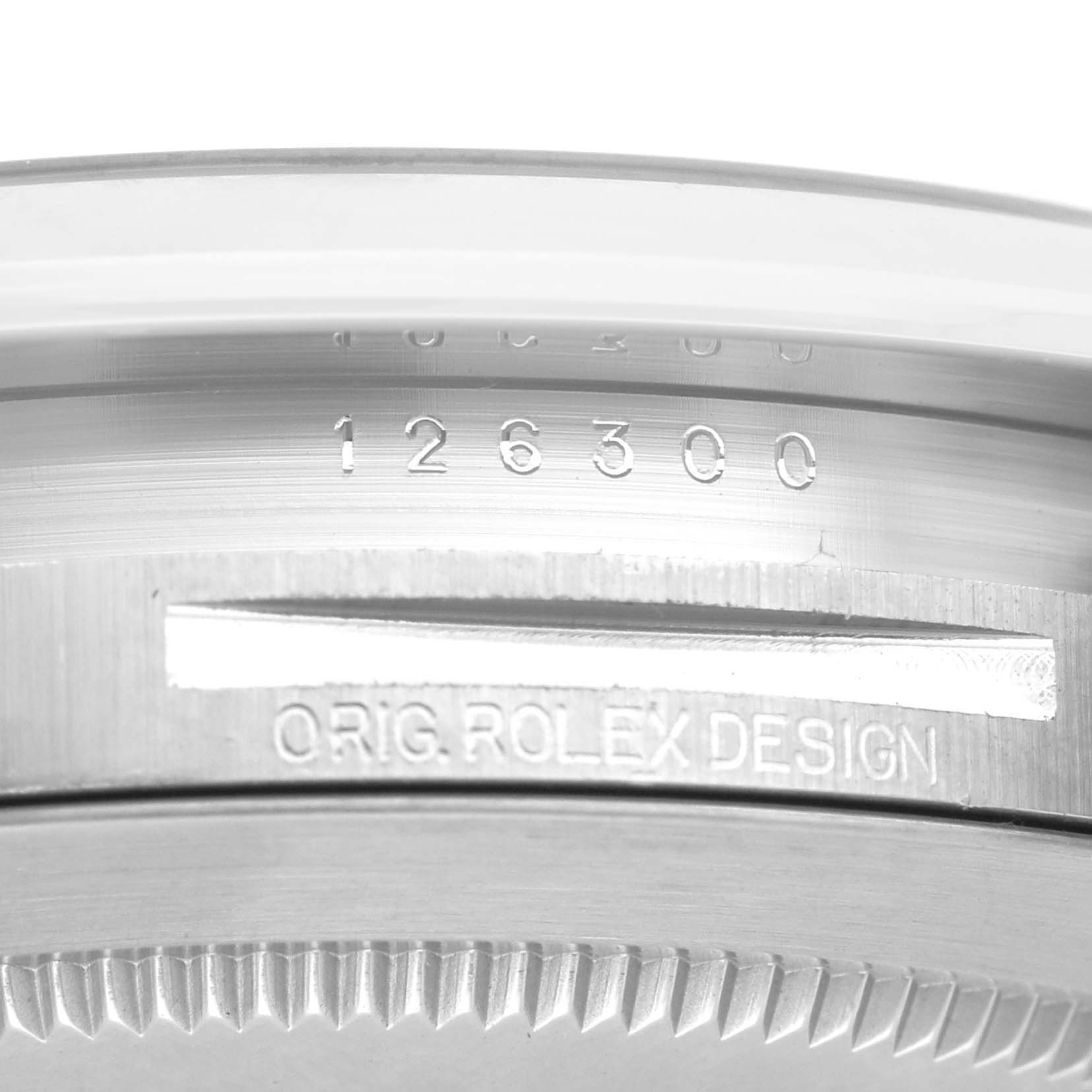 The image shows the side of the Rolex Datejust 41 126300 Men's Stainless Steel Green Dial 126300 Men's Stainless Steel Green Dial, highlighting the model number and "ORIG. ROLEX DESIGN" inscription.