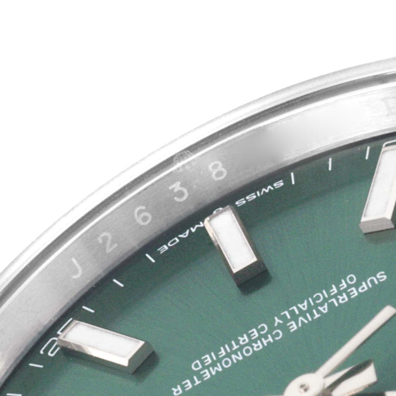 The image shows a close-up of the Rolex Datejust 41 126334 Men's Stainless Steel Green Dial 126334 Men's Stainless Steel Green Dial dial, highlighting the bezel, markers, and text.