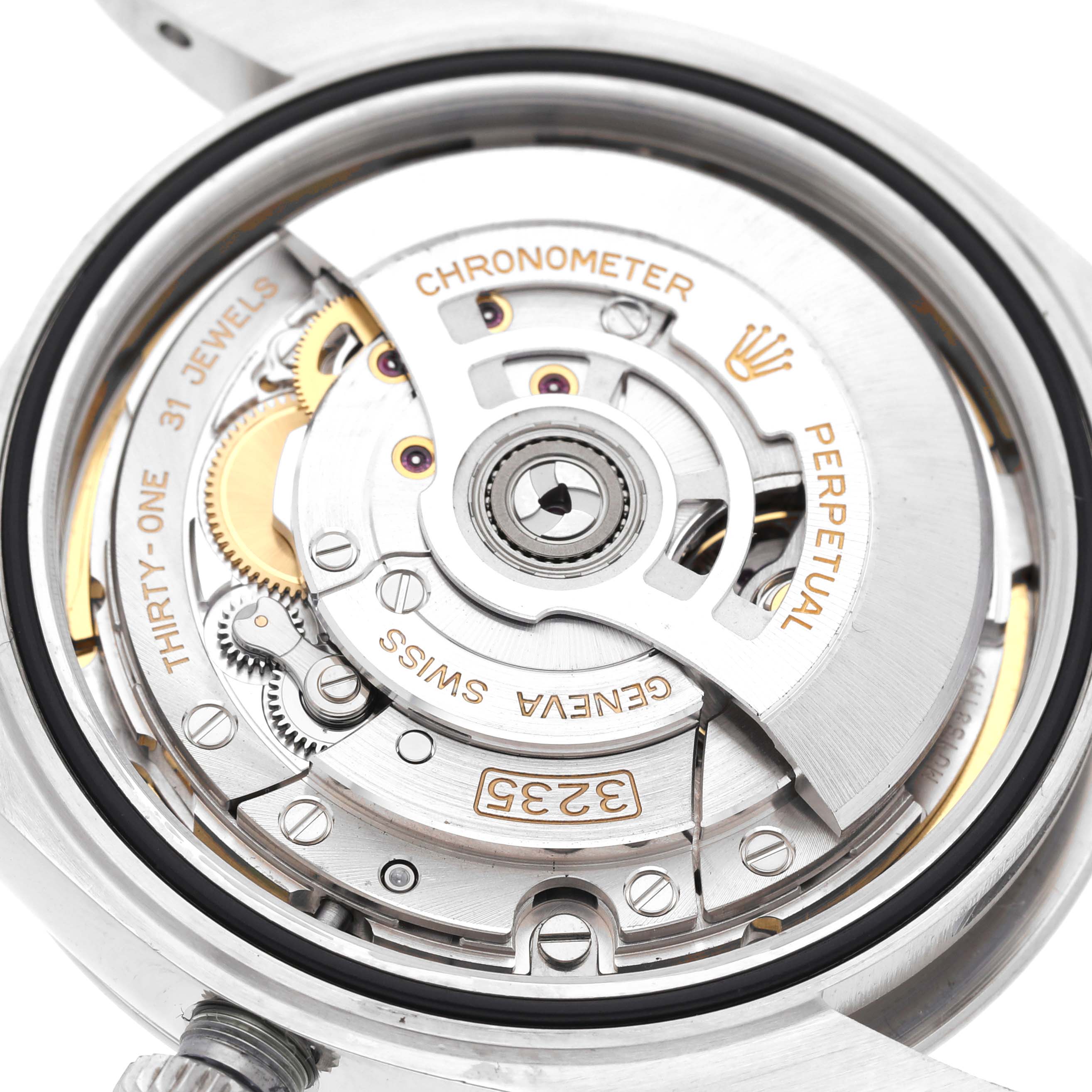 This image shows the internal mechanism of a Rolex Datejust 41 126334 Men's Stainless Steel Green Dial 126334 Men's Stainless Steel Green Dial, highlighting its rotor and intricate movement parts.