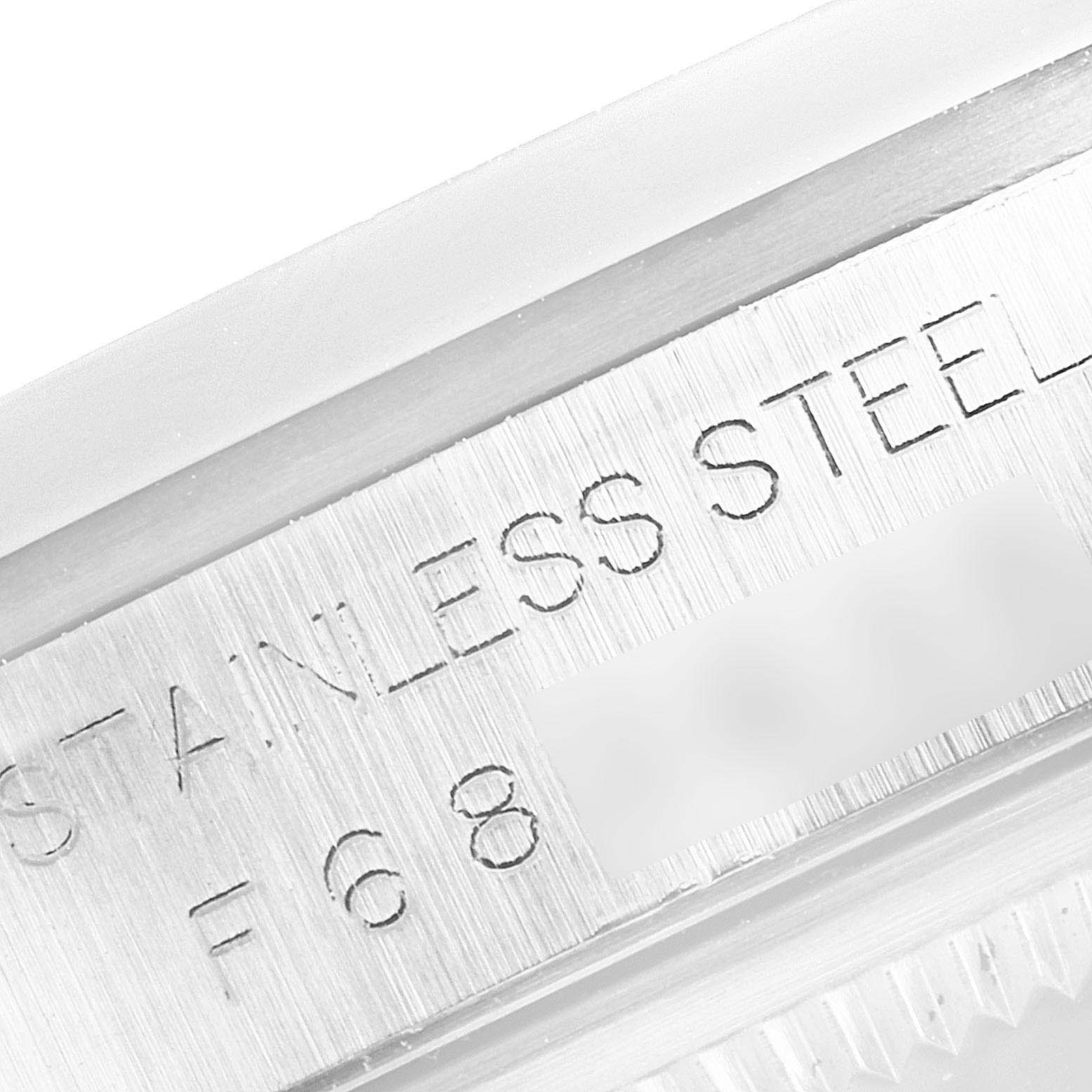 This image shows a close-up view of the engraved text on the side of the case of a Rolex Datejust 16200 Men's Stainless Steel Black Dial 16200 Men's Stainless Steel Black Dial watch.