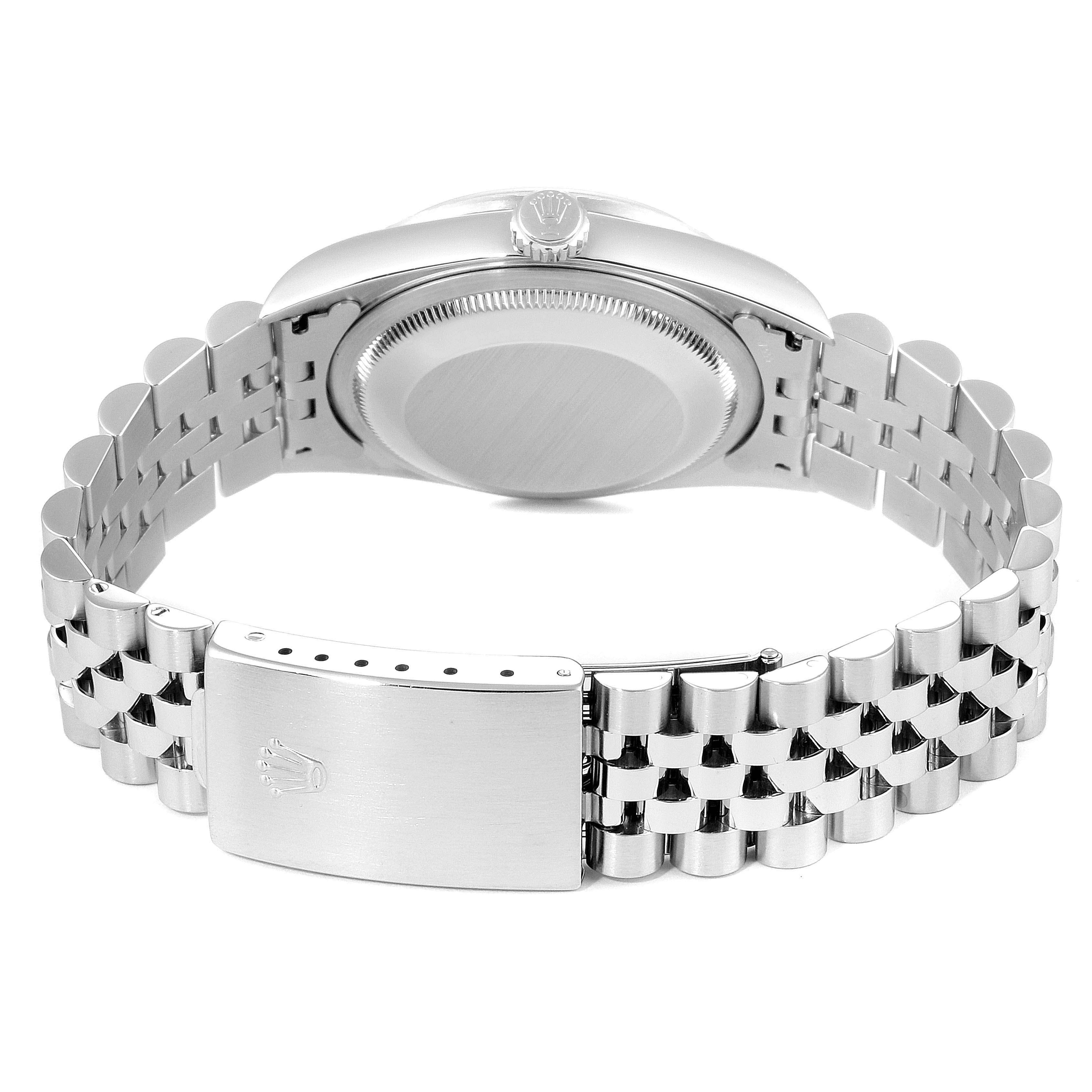 This image of a Rolex Datejust 16220 Men's Stainless Steel Blue Dial 16220 Men's Stainless Steel Blue Dial watch shows the back case, crown, and clasp from a rear view angle.