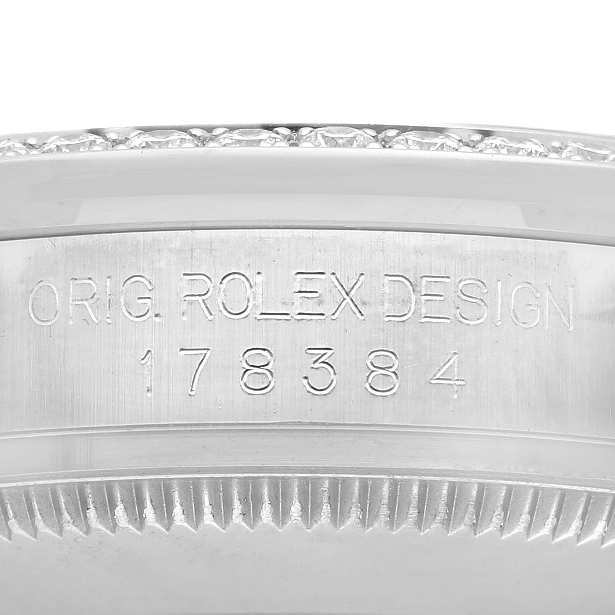 The image shows a close-up of the model number "178384" engraved on a Rolex Mid-Size 178384 Women's Stainless Steel Black Dial 178384 Women's Stainless Steel Black Dial watch case.