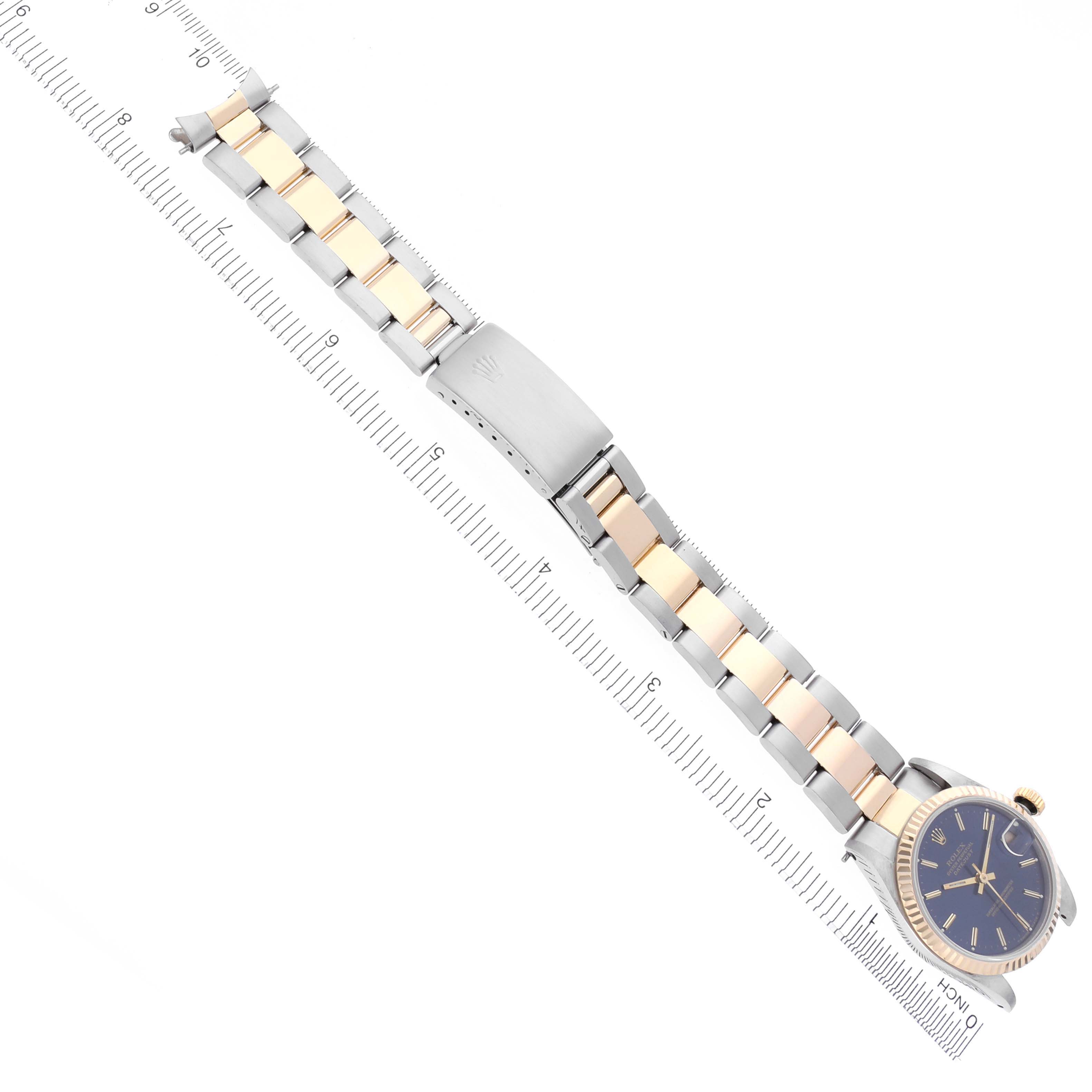 The Rolex Mid-Size 68273 Women's Steel and Gold (two tone) Blue Dial 68273 Women's Steel and Gold (two tone) Blue Dial watch is shown from a top view, highlighting the bracelet, clasp, and partially the face.