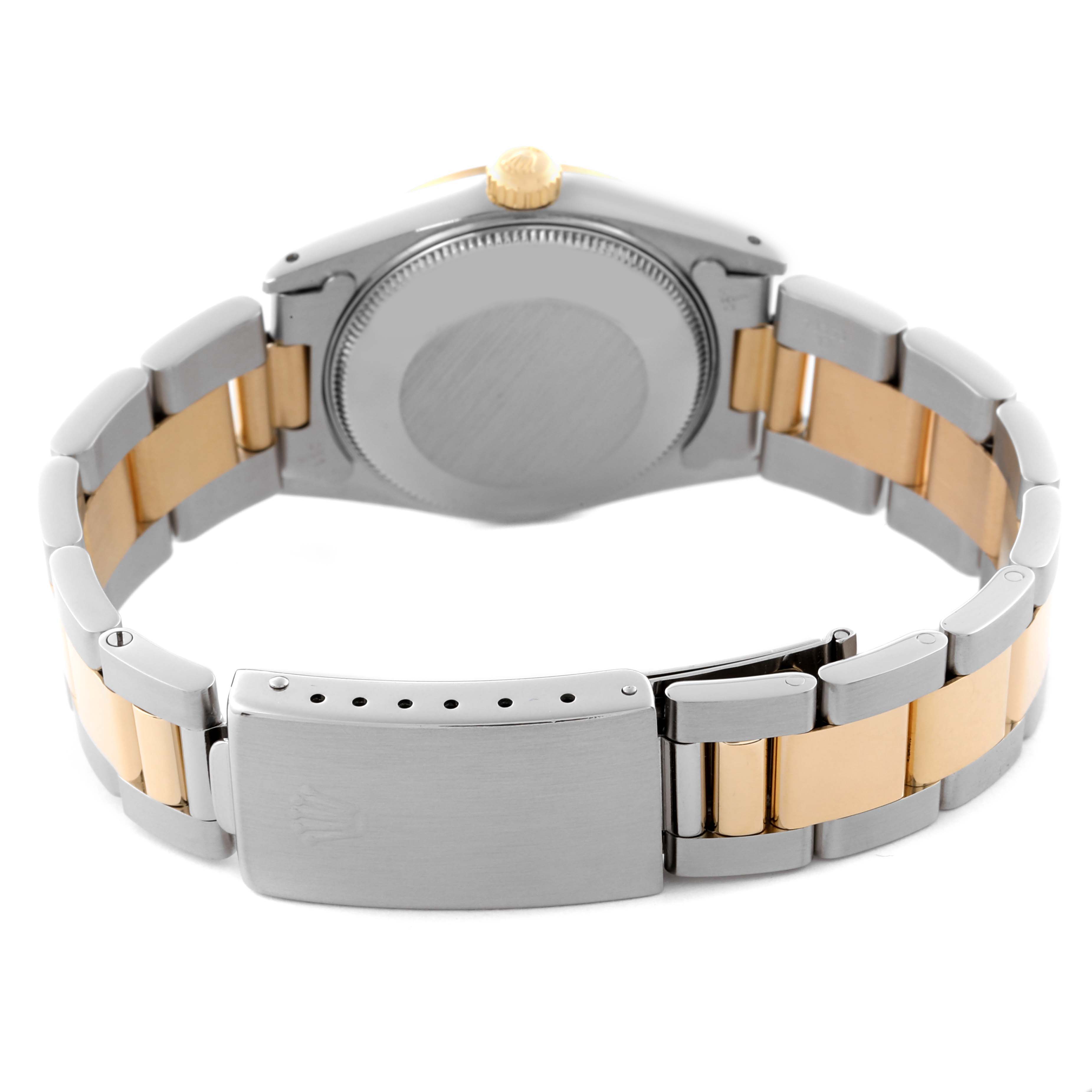 The Rolex Mid-Size 68273 Women's Steel and Gold (two tone) Blue Dial 68273 Women's Steel and Gold (two tone) Blue Dial watch is shown from the back, highlighting the clasp and two-tone bracelet.