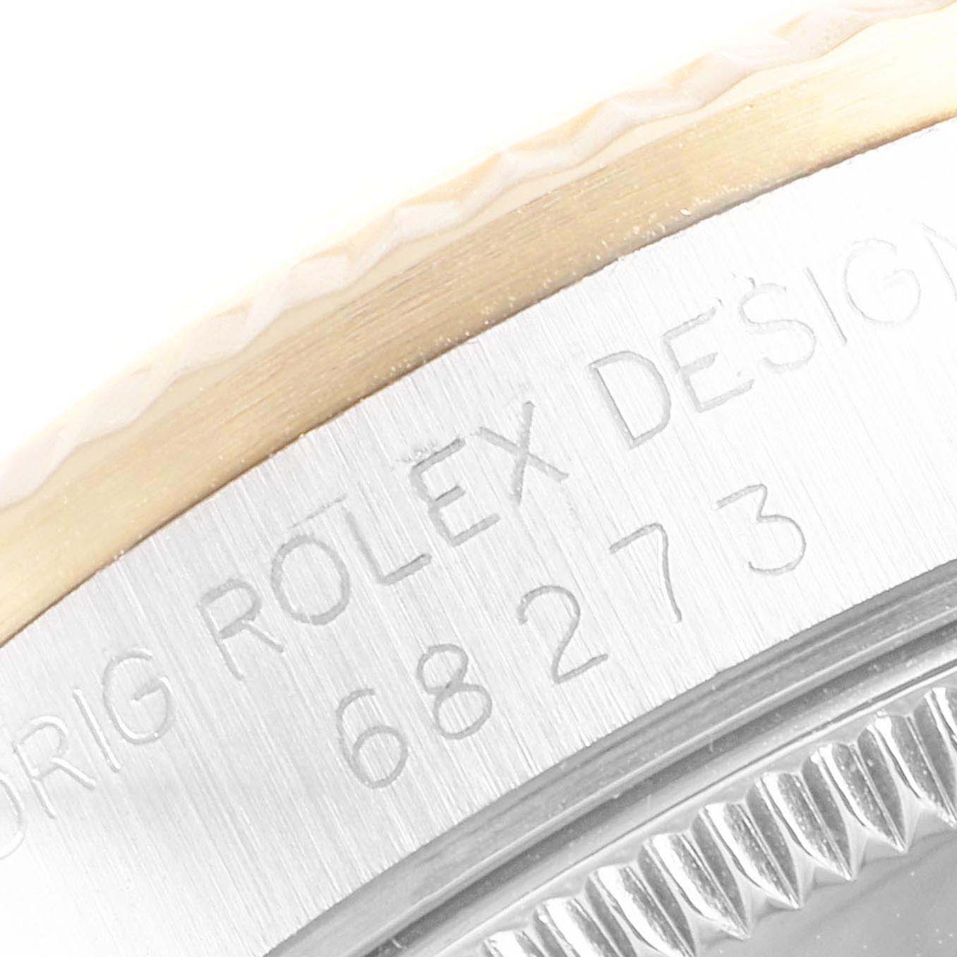 The image shows a close-up of the case back and bezel of a Rolex Mid-Size 68273 Women
s Steel and Gold (two tone) Beige Dial 68273 Women
s Steel and Gold (two tone) Beige Dial watch, highlighting the engraved model number.
