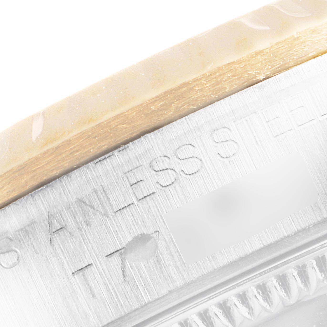 This image shows a close-up of the side of the Mid-Size Rolex watch case, highlighting the stainless steel marking.