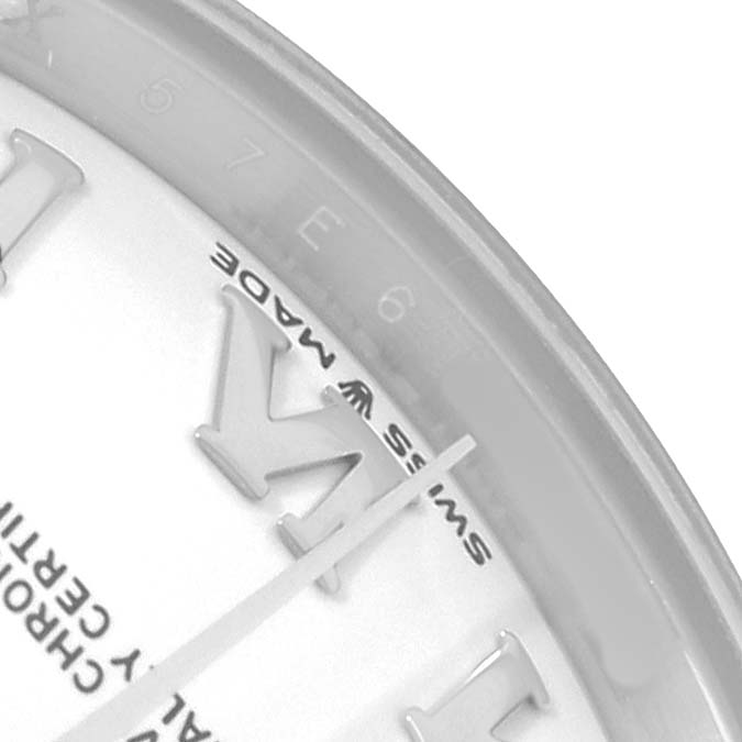 The image shows a partial close-up of the Rolex Mid-Size 278240 Women
s Stainless Steel White Dial watch face, focusing on the hour markers and "Swiss Made" text.