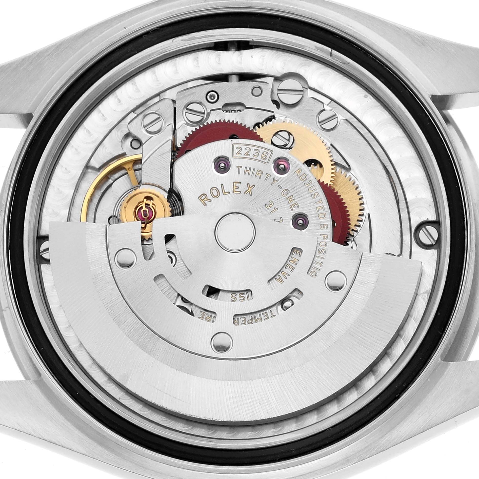 The image shows a back view of a Rolex Mid-Size 278240 Women
s Stainless Steel White Dial model, highlighting the movement and internal mechanics.