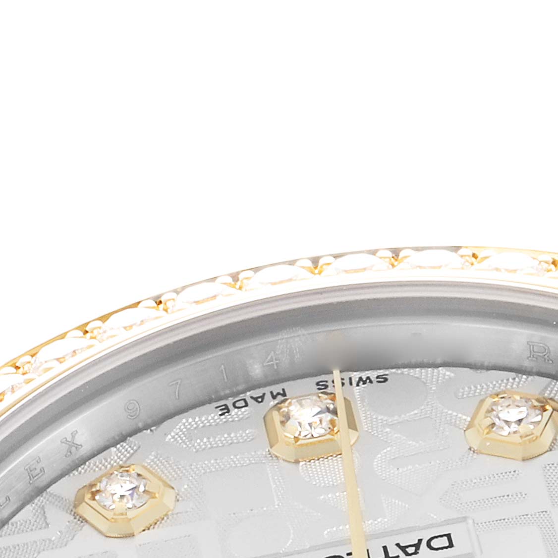 The image shows a close-up of the upper part of a Rolex Mid-Size 178383 Women
s Steel and Gold (two tone) Silver Dial watch, featuring the bezel, part of the dial, and diamond hour markers.