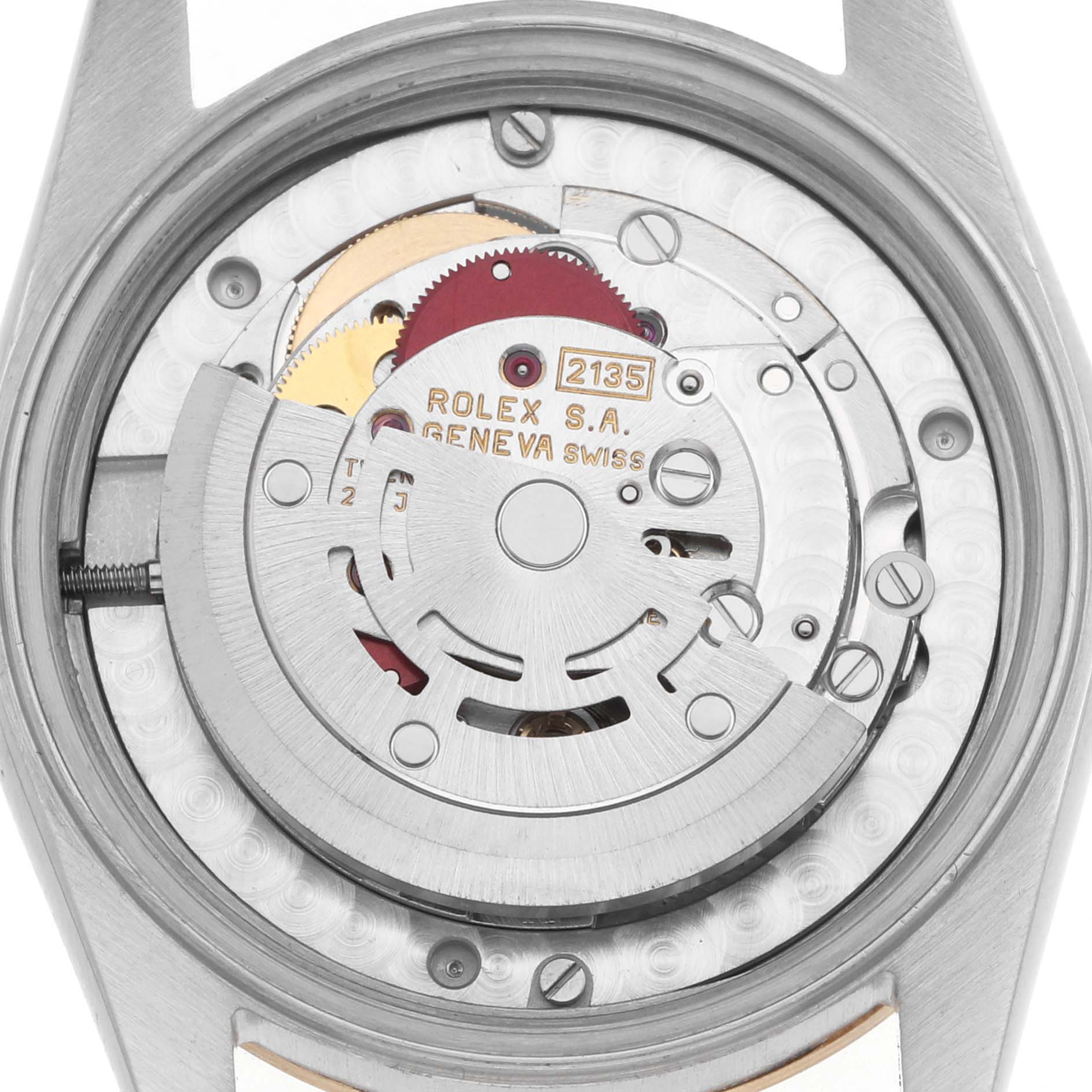 The image shows the back view of a Rolex Datejust 68273 Women
s Steel and Gold (two tone) Champagne Dial, focusing on the movement and internal components.
