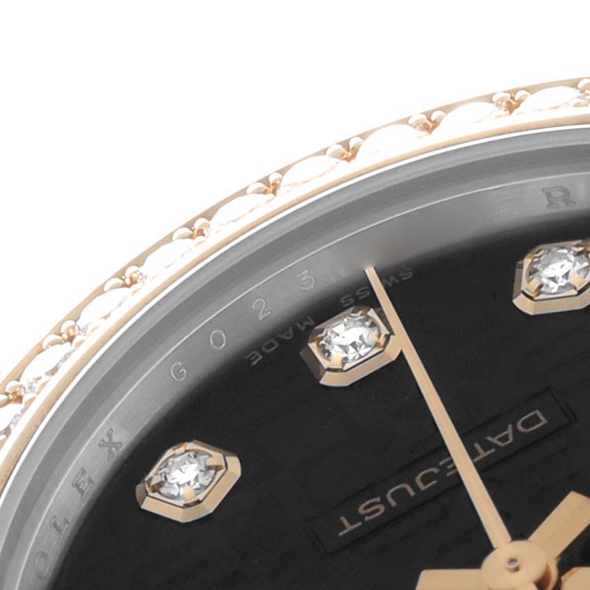 The image shows a close-up angle of a Rolex Mid-Size 178383 Women
s Steel and Gold (two tone) Black Dial watch featuring diamond hour markers and part of the bezel.