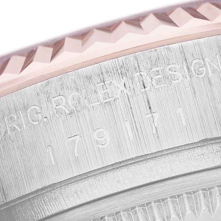 The image shows a close-up of the Rolex Datejust 179171 Women's Steel and Gold (two tone) Blue Dial model's side, featuring the engraved branding and serial number.