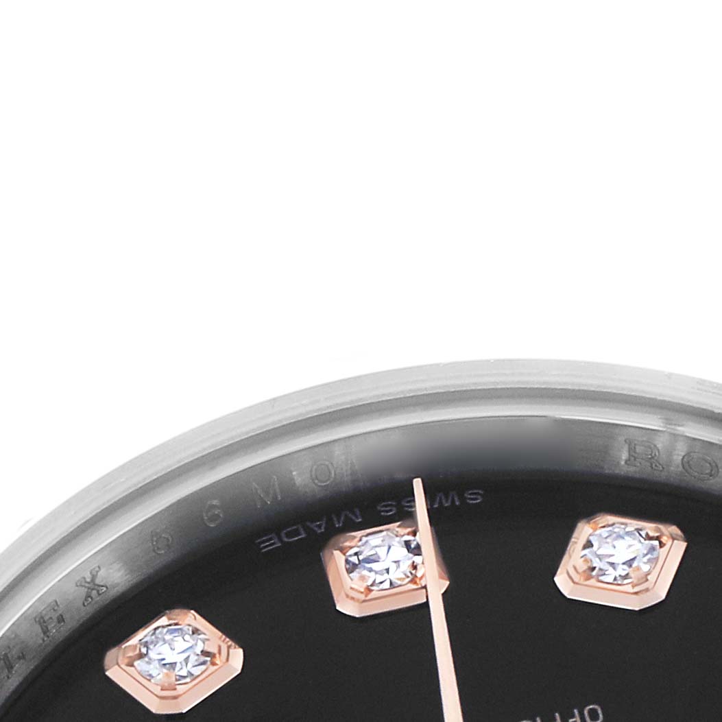 The image shows a partial view of a Rolex Datejust 179171 Women
s Steel and Gold (two tone) Black Dial watch, highlighting diamond hour markers and part of the dial and bezel.