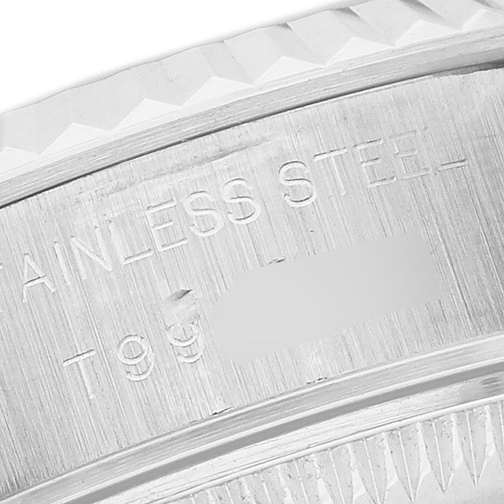 The image shows a close-up of the edge and engraved markings on the case of a Rolex Datejust 69174 Women's Stainless Steel Pink Dial watch.