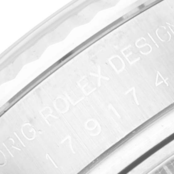 This image shows a close-up view of the engraved writing on the side of the Rolex Datejust 179174 Women's Stainless Steel Silver Dial 179174 Women's Stainless Steel Silver Dial watch case.