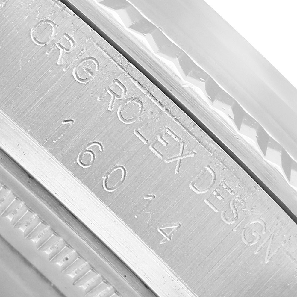 The image shows a close-up of the engraved side of the case of a Rolex Datejust 16014 Men's Stainless Steel Silver Dial, featuring its model number.