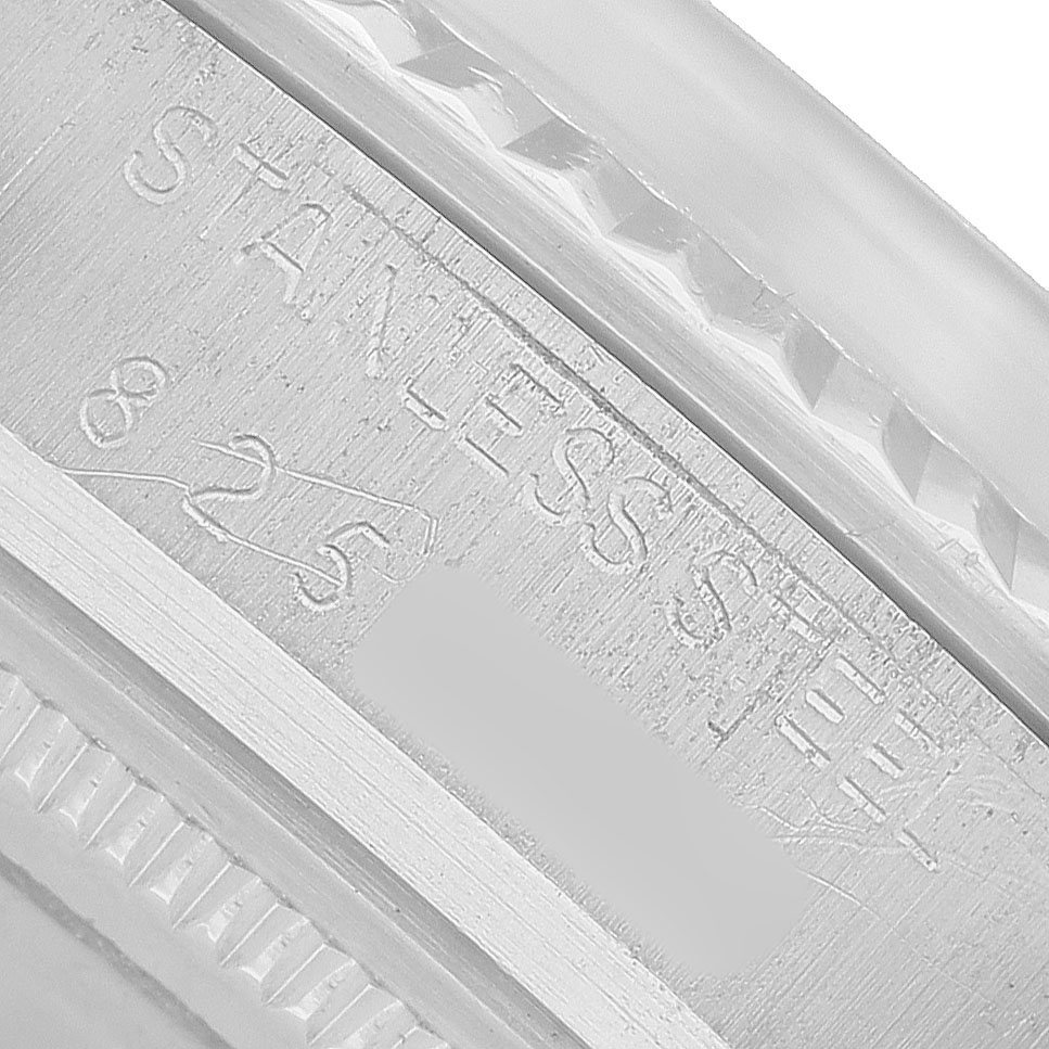 The image shows a close-up angle of the engraved inner case of a Rolex Datejust 16014 Men's Stainless Steel Silver Dial watch.