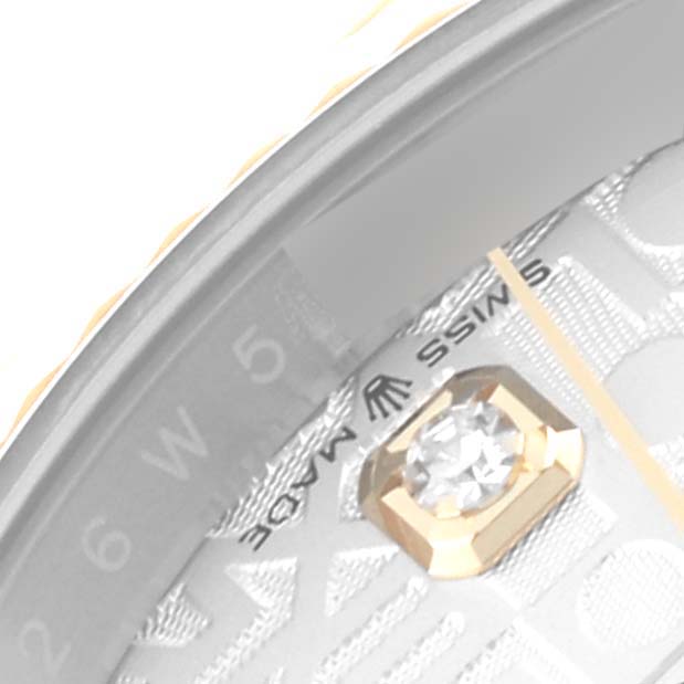 This close-up of the Rolex Datejust 126233 Men
s Steel and Gold (two tone) Silver Dial watch shows the dial, part of the bezel, a diamond hour marker, and the "SWISS MADE" text.