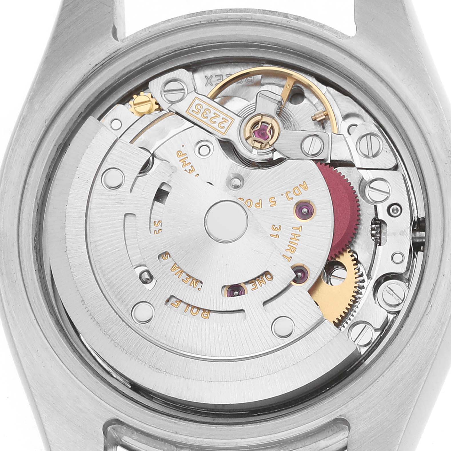 This image shows the movement of a Rolex Datejust 179173 Women
s Steel and Gold (two tone) Champagne Dial watch from a top-down angle, focusing on its inner mechanical parts.