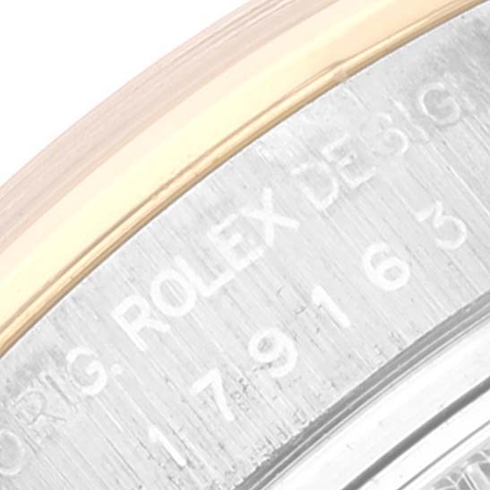 The image shows a close-up of the stainless steel back and part of the gold bezel of the Rolex Datejust 179163 Women's Steel and Gold (two tone) White Dial 179163 Women's Steel and Gold (two tone) White Dial model, with text and numbers engraved.