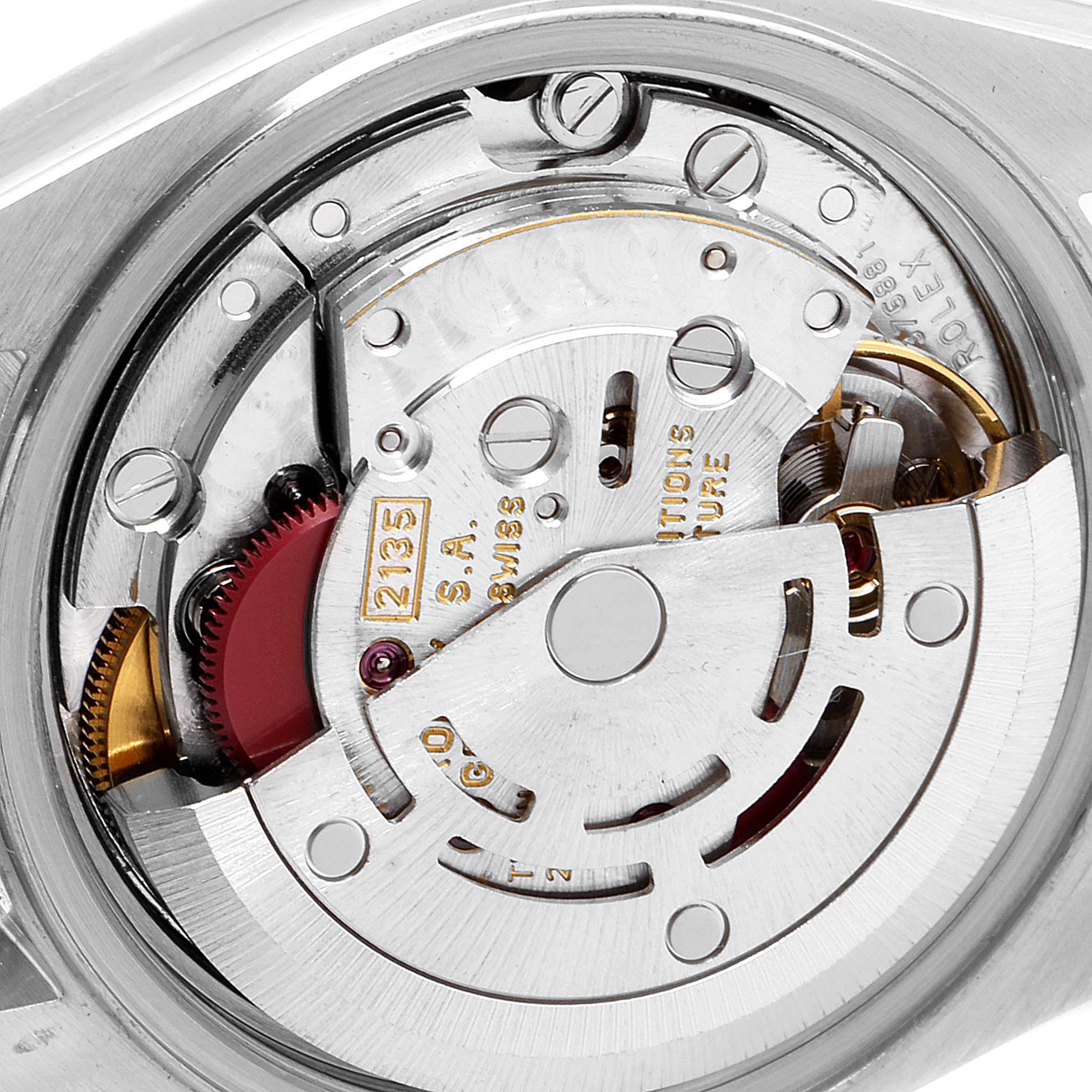 The image shows the intricate internal mechanism of a Rolex Datejust 69173 Women's Steel and Gold (two tone) White Dial 69173 Women's Steel and Gold (two tone) White Dial watch, focusing on its movement from an angled view.