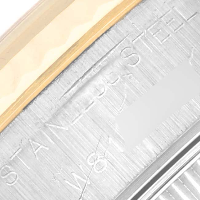 The close-up image shows the side engraving on the bezel and case of a Rolex Datejust 69173 Women's Steel and Gold (two tone) Champagne Dial 69173 Women's Steel and Gold (two tone) Champagne Dial watch.