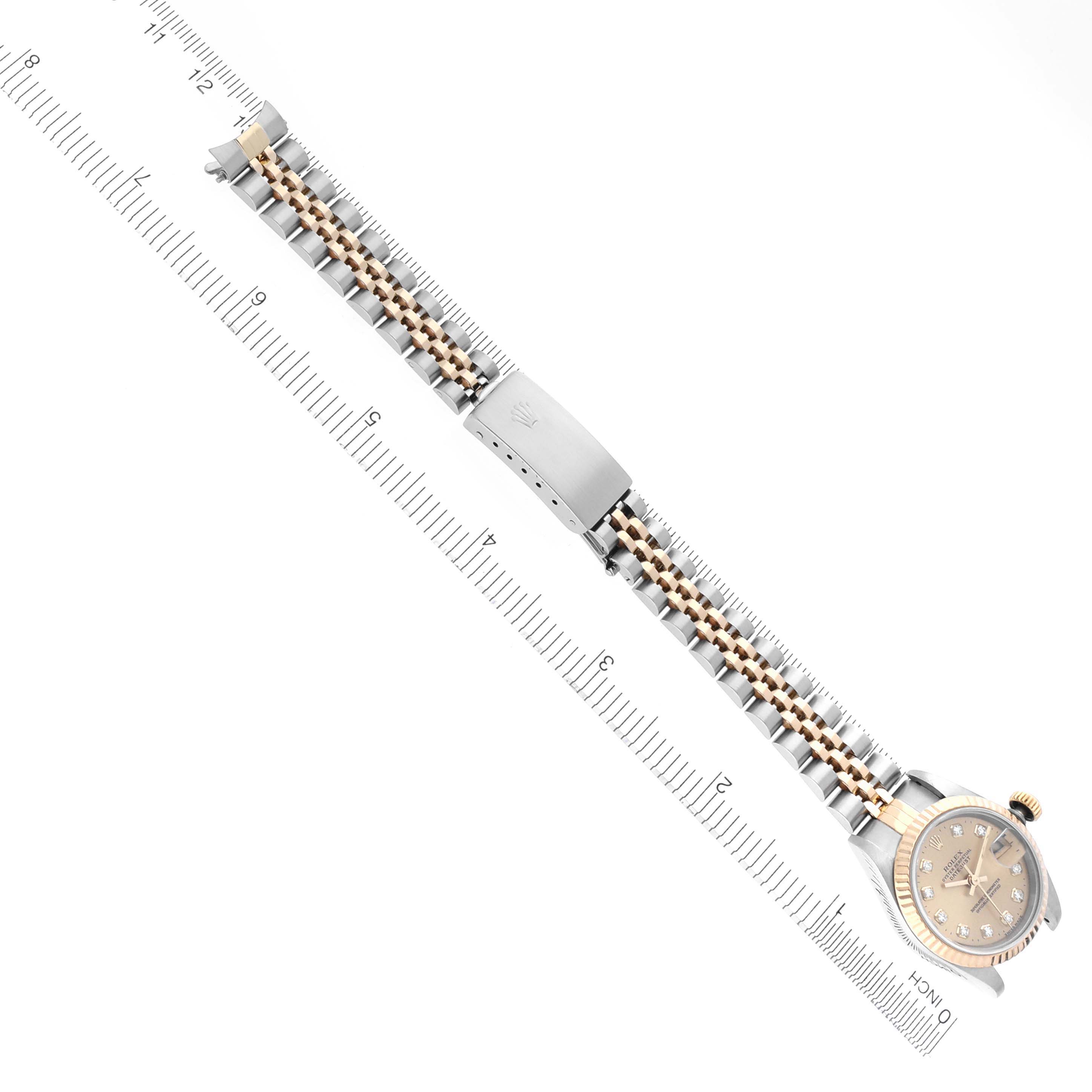 The Rolex Datejust 69173 Women's Steel and Gold (two tone) Champagne Dial 69173 Women's Steel and Gold (two tone) Champagne Dial watch is shown from a top view, featuring the face, bracelet, and clasp.