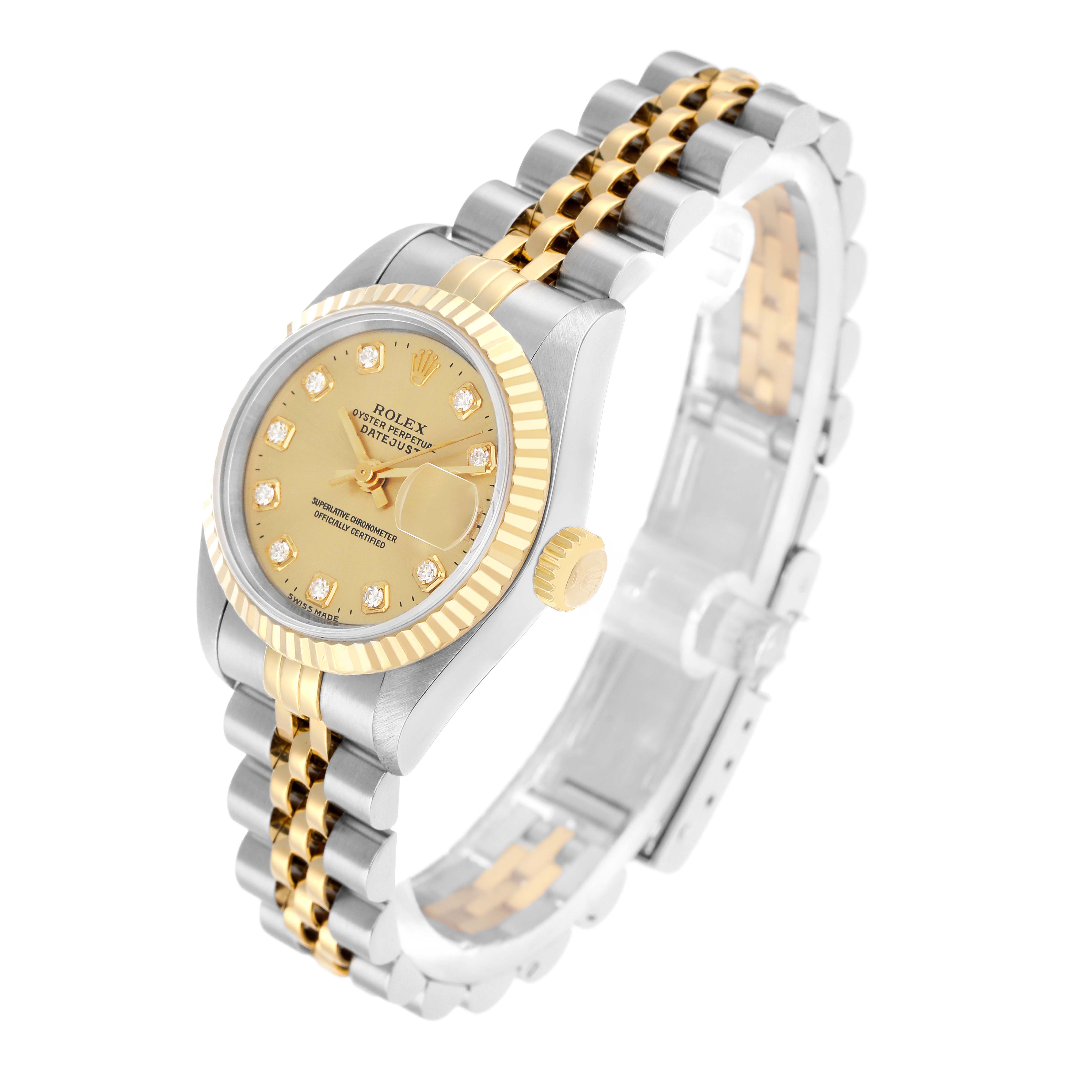 The Rolex Datejust 69173 Women
s Steel and Gold (two tone) Champagne Dial watch is shown at an angled view, highlighting the gold and silver bracelet, fluted bezel, and the dial with markers.