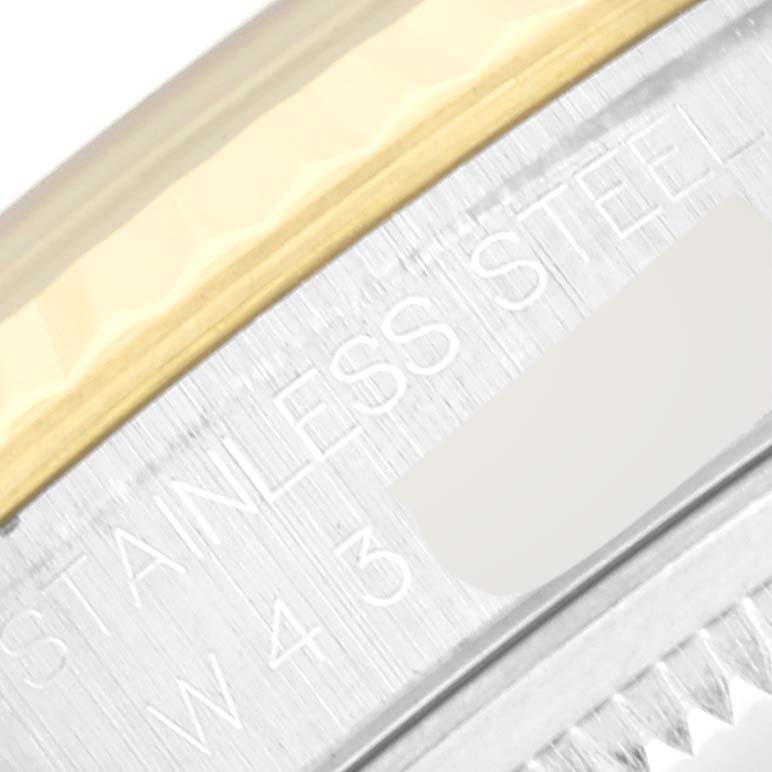The image shows a close-up of the side case and bezel of a Rolex Datejust 16233 Men's Steel and Gold (two tone) Champagne Dial 16233 Men's Steel and Gold (two tone) Champagne Dial, highlighting the stainless steel and gold accents.