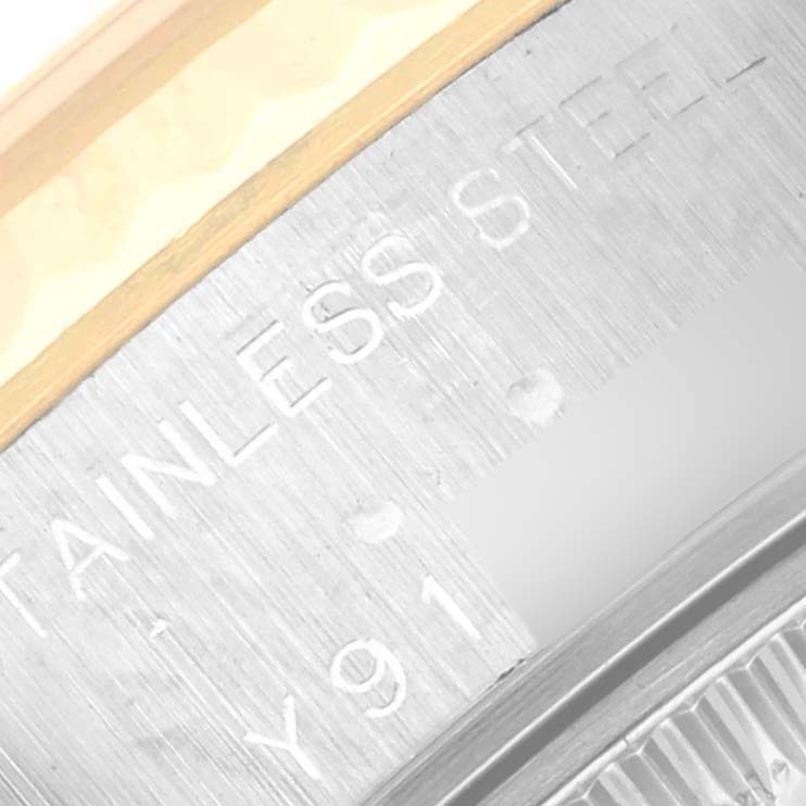 This image shows a close-up of the edge with "STAINLESS STEEL" engraving on the Rolex Datejust 79173 Women's Steel and Gold (two tone) Beige Dial 79173 Women's Steel and Gold (two tone) Beige Dial watch.