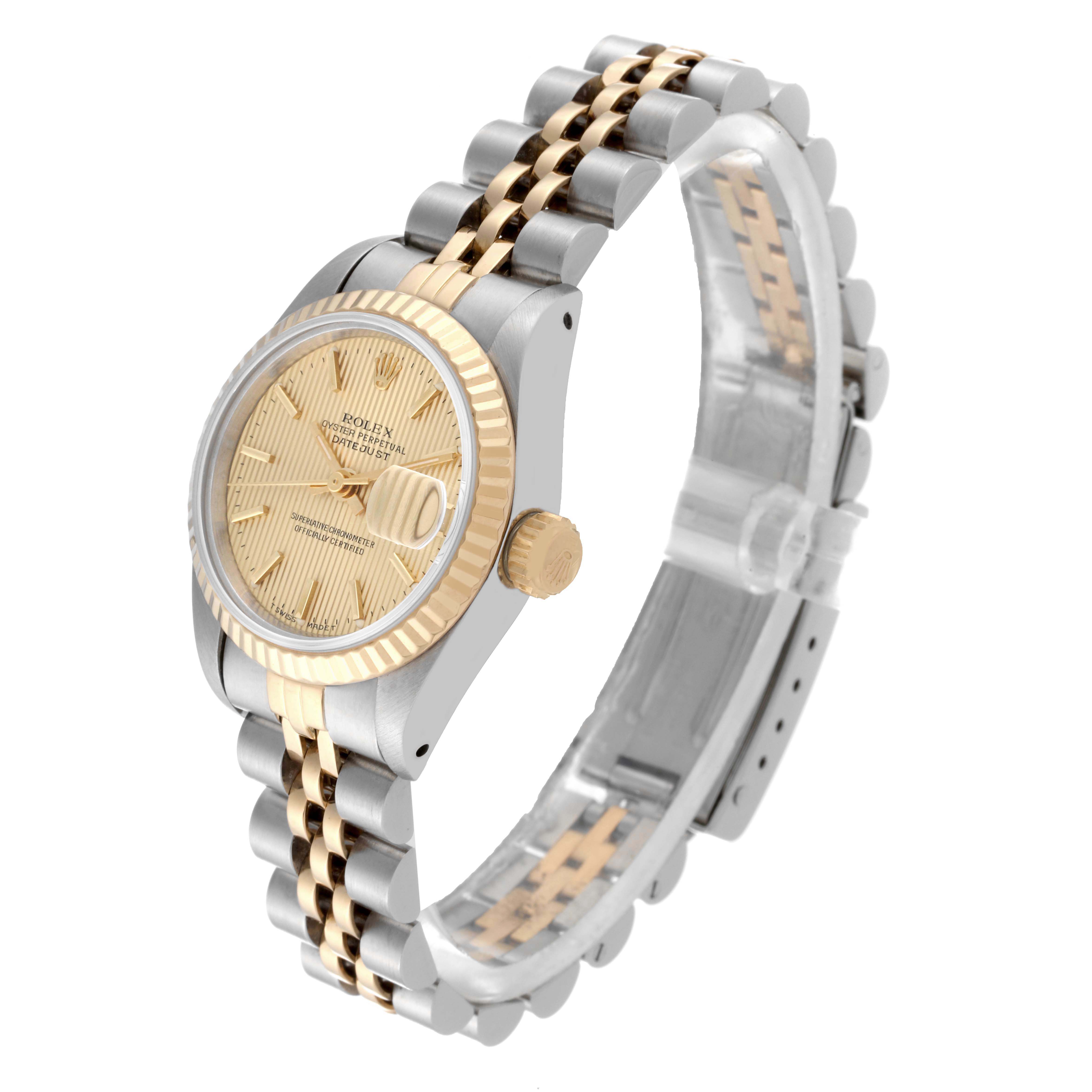 The Rolex Datejust 69173 Women's Steel and Gold (two tone) Champagne Dial 69173 Women's Steel and Gold (two tone) Champagne Dial watch is shown at an angled side view, highlighting the dial, bezel, crown, and bracelet.