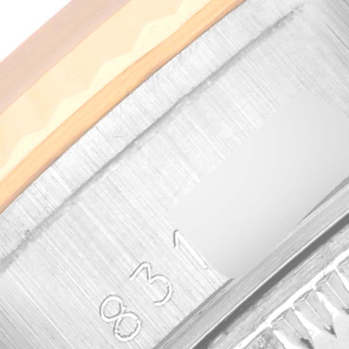 The image shows a close-up angle of the case side, detailing engraved numbers on the Rolex Datejust 69173 Women's Steel and Gold (two tone) Champagne Dial 69173 Women's Steel and Gold (two tone) Champagne Dial.