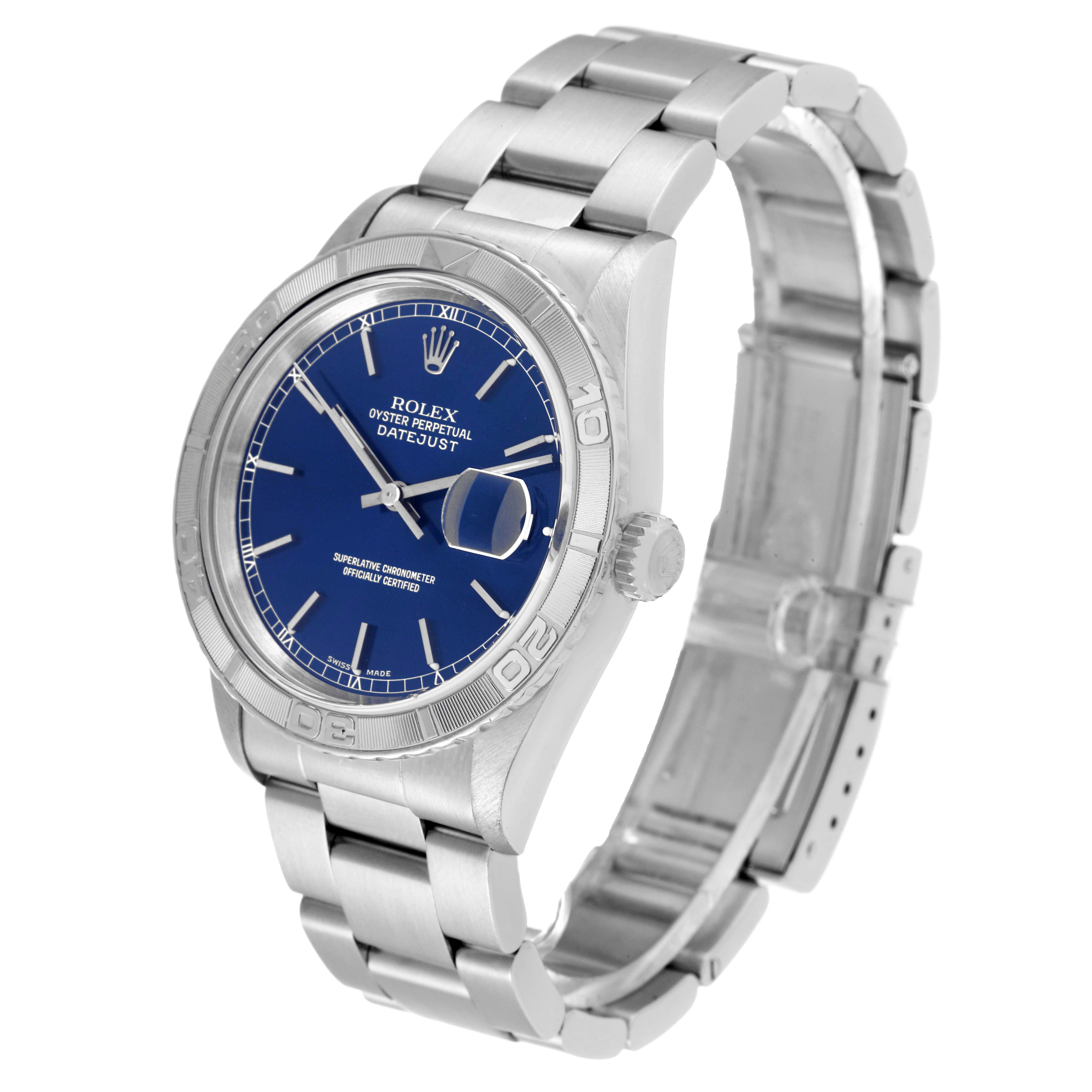 The image shows a Rolex Turn-o-Graph 16264 Men
s Stainless Steel Blue Dial 16264 Men
s Stainless Steel Blue Dial Datejust from a side angle, highlighting its bezel, blue dial, and metal bracelet.