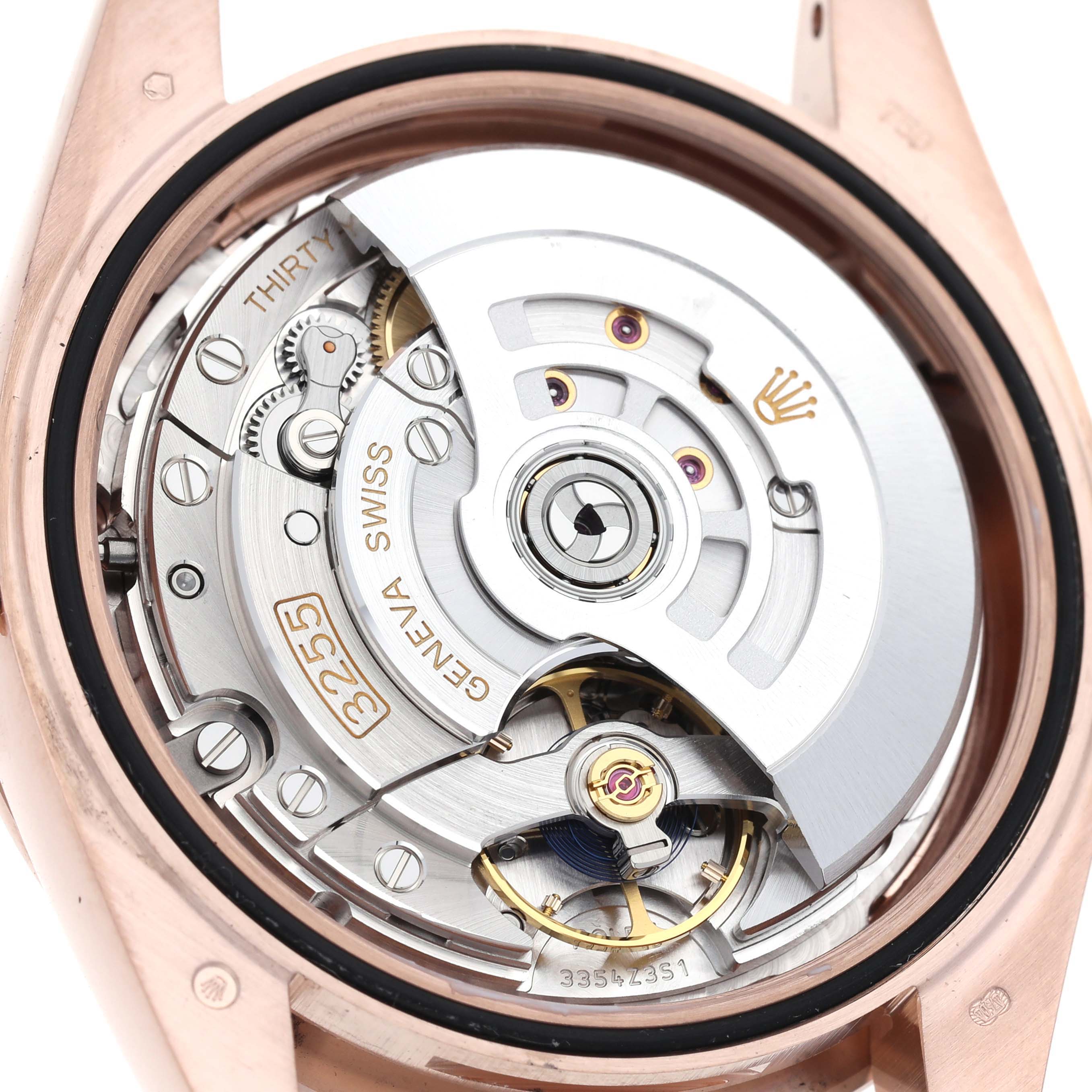 The image shows the movement and internal mechanics of a Rolex President 228345 Men's Rose Gold Pink Dial 228345 Men's Rose Gold Pink Dial model from a rear angle.