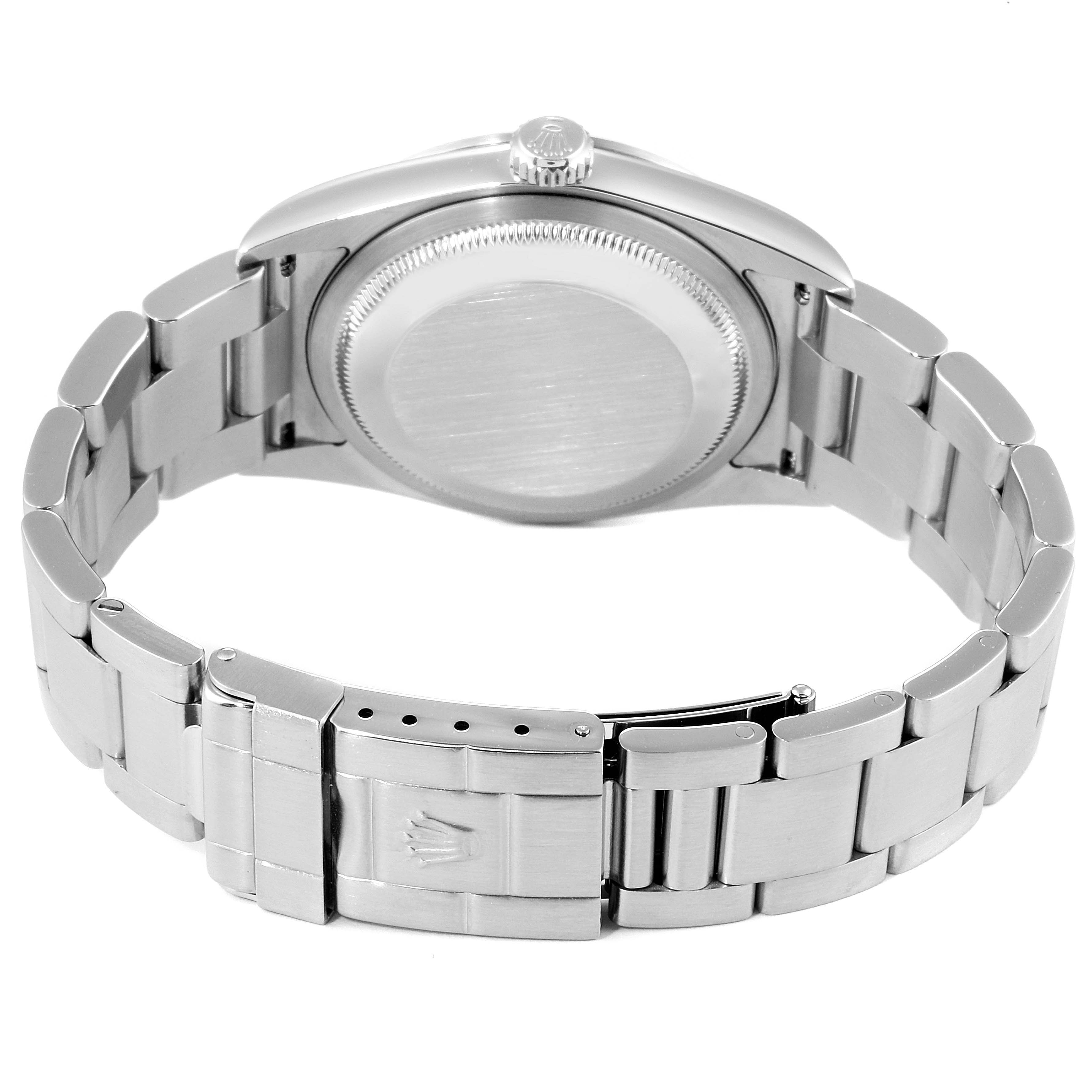 The image shows the rear view of the Rolex Explorer 114270 Men
s Stainless Steel Black Dial 114270 Men
s Stainless Steel Black Dial, highlighting its case back, crown, and stainless steel bracelet with a clasp.