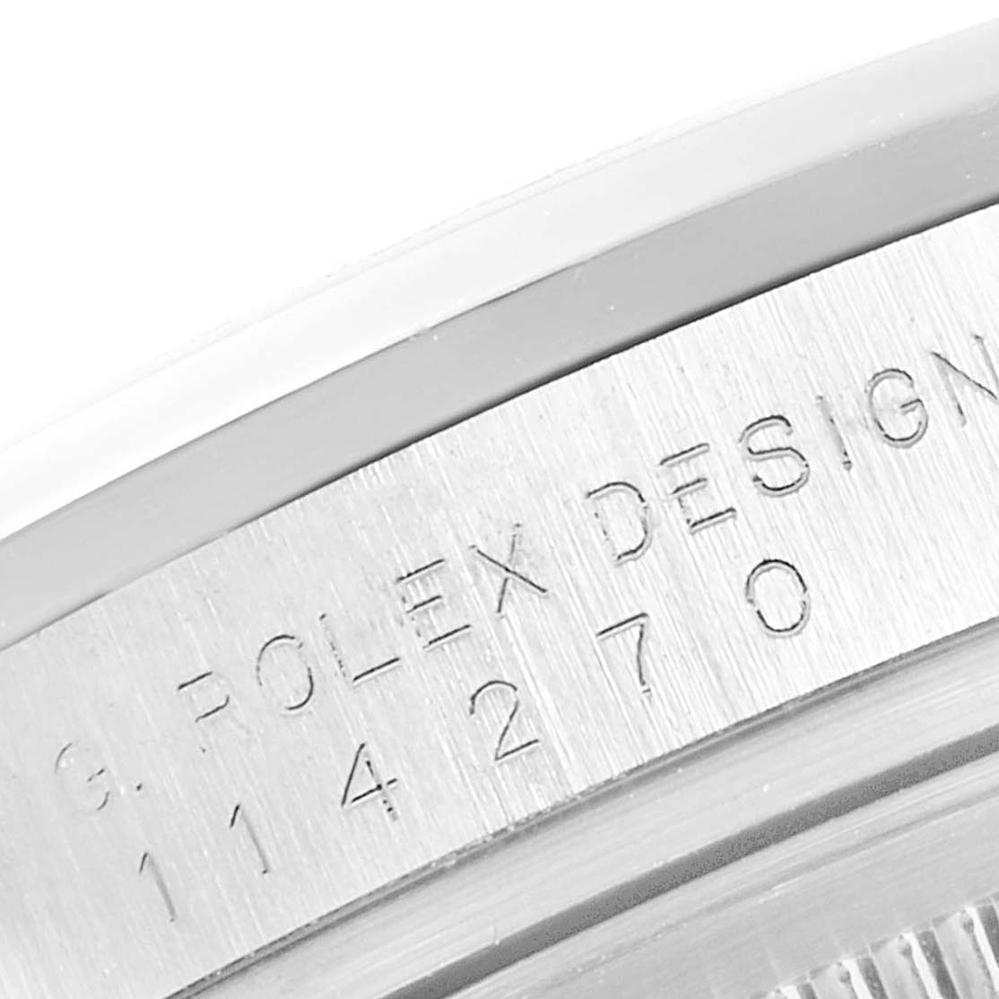 This is a close-up angle of the case back of a Rolex Explorer 114270 Men
s Stainless Steel Black Dial 114270 Men
s Stainless Steel Black Dial, showing the model number and brand engraving.