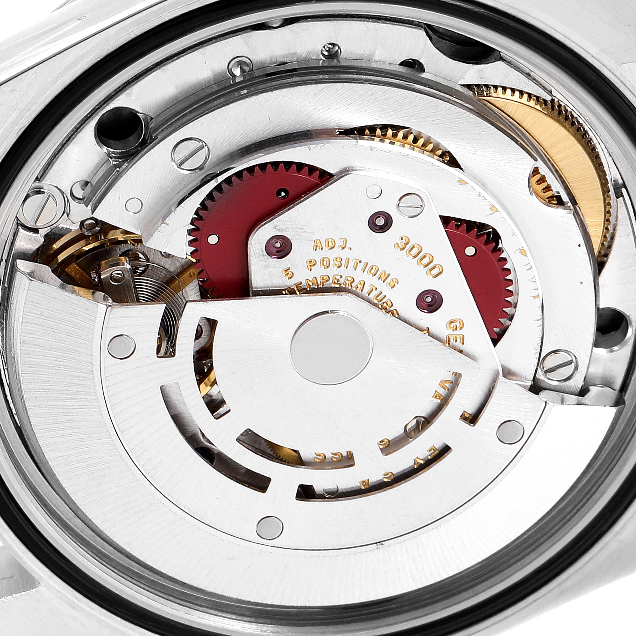 The image shows a close-up view of the internal mechanism of the Rolex Explorer 14270 Men
s Stainless Steel Black Dial 14270 Men
s Stainless Steel Black Dial watch, highlighting gears and other components.