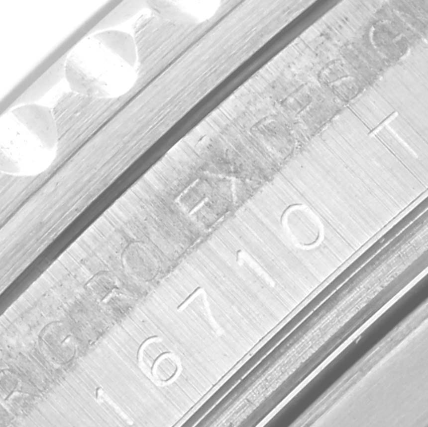 The Rolex GMT-Master 16710 Men
s Stainless Steel Black Dial 16710 Men
s Stainless Steel Black Dial model is shown at an angle highlighting the engraved inner bezel.