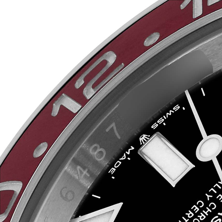 The image shows a close-up of the bezel and part of the dial of a Rolex GMT-Master 126710 Men's Stainless Steel Black Dial 126710 Men's Stainless Steel Black Dial watch.