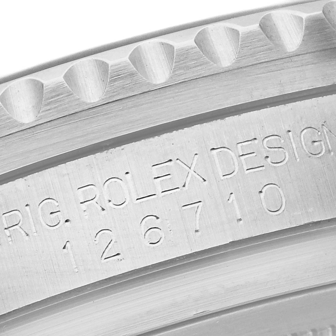 This close-up image shows the engraved case side of a Rolex GMT-Master 126710 Men's Stainless Steel Black Dial 126710 Men's Stainless Steel Black Dial, highlighting the model number 126710.