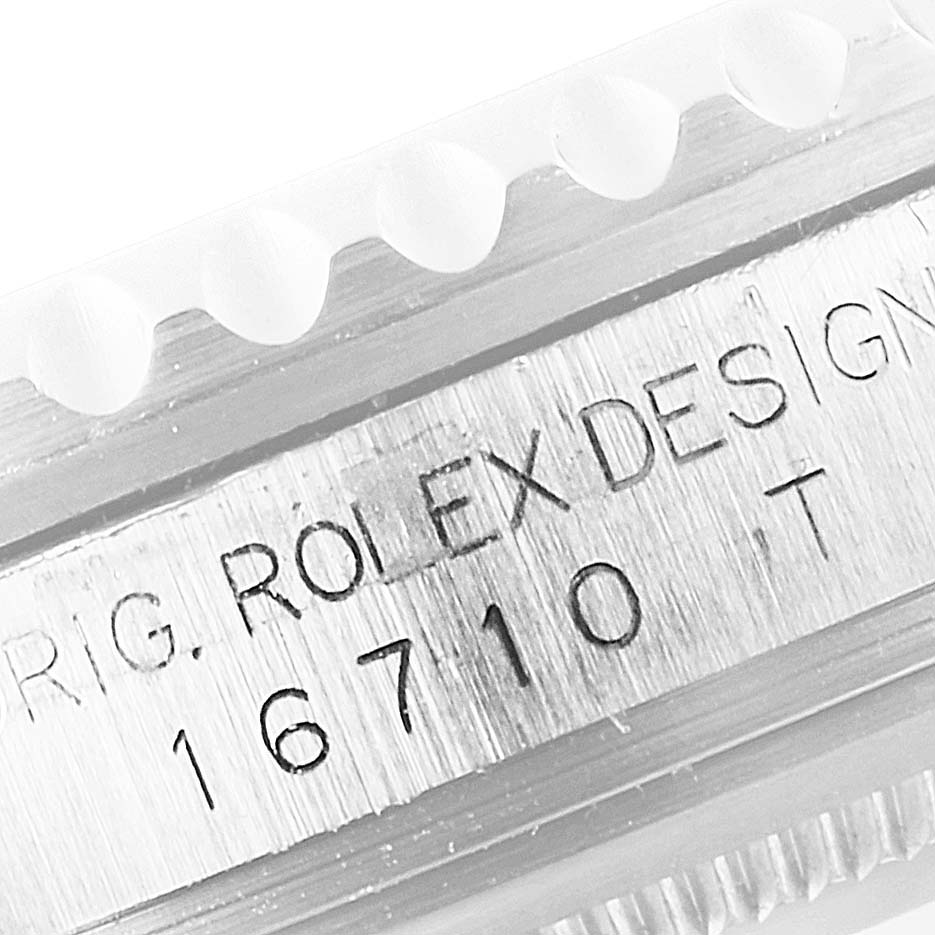 This close-up image shows the model number "16710" and part of the bezel of a Rolex GMT-Master 16710 Men's Stainless Steel Black Dial 16710 Men's Stainless Steel Black Dial watch.