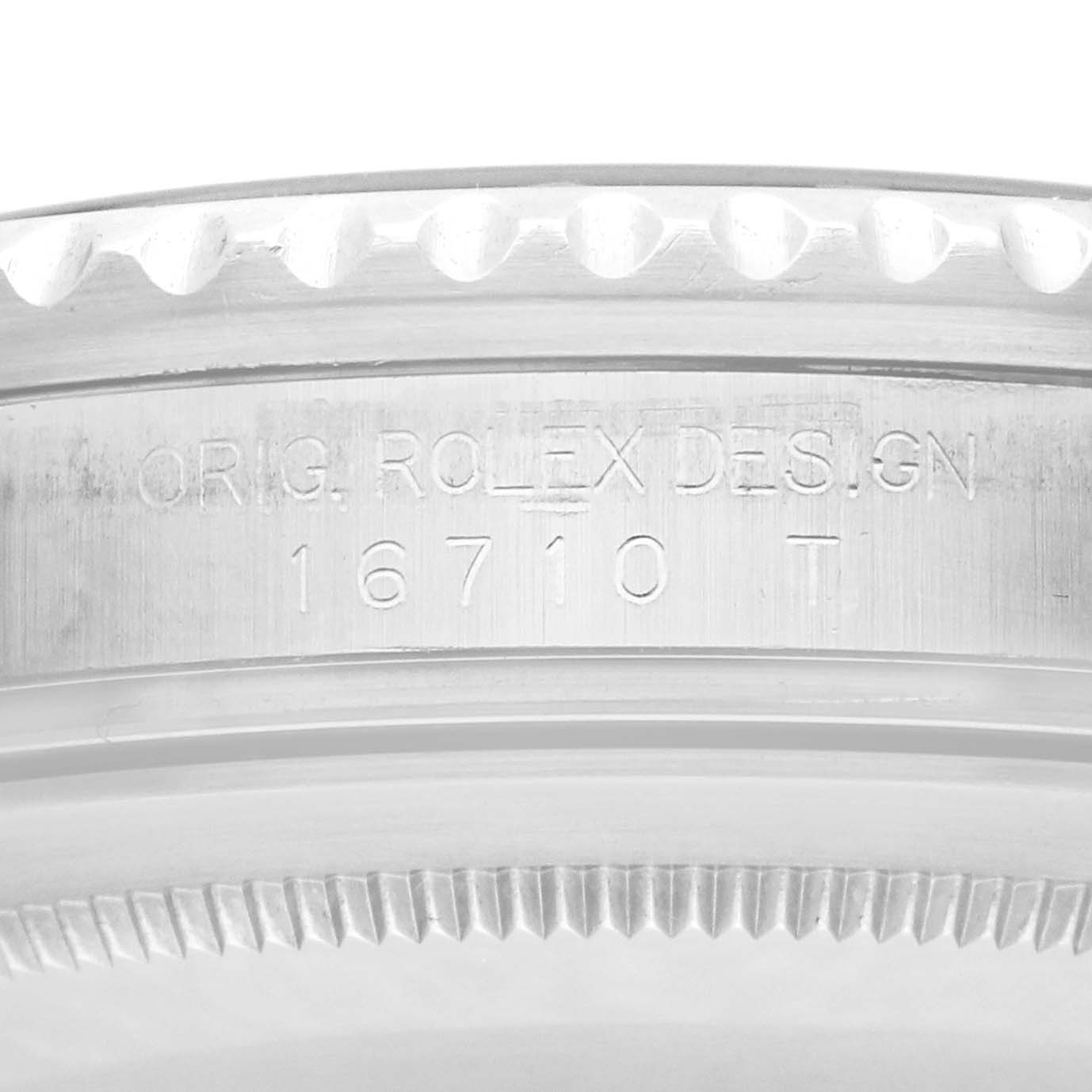 The image shows a close-up of the side of the case of a Rolex GMT-Master 16710 Men
s Stainless Steel Black Dial, highlighting the engraved model number.