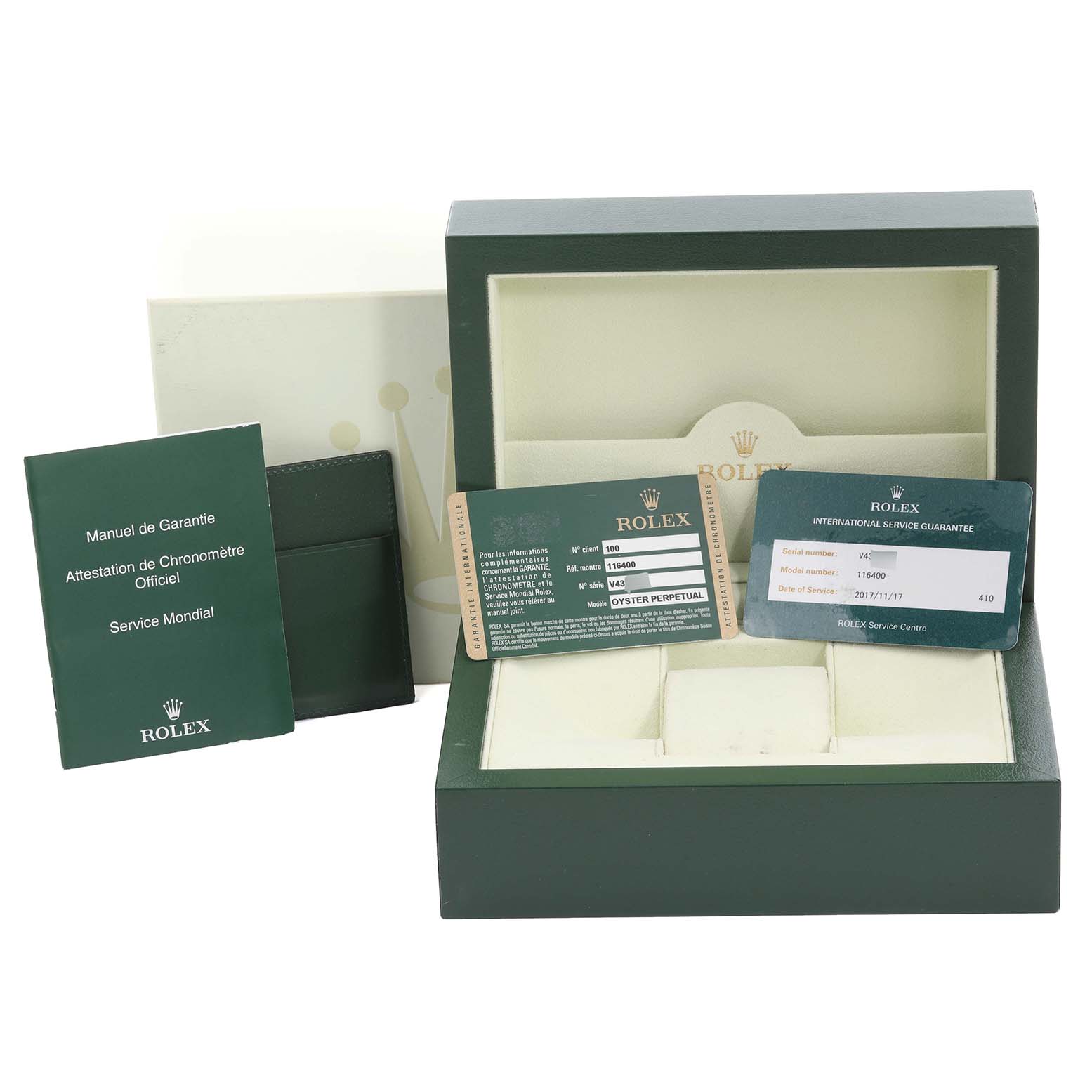 The image shows the packaging and documents for a Rolex Milgauss 116400 Men
s Stainless Steel Black Dial 116400 Men
s Stainless Steel Black Dial watch, including the box and warranty cards.